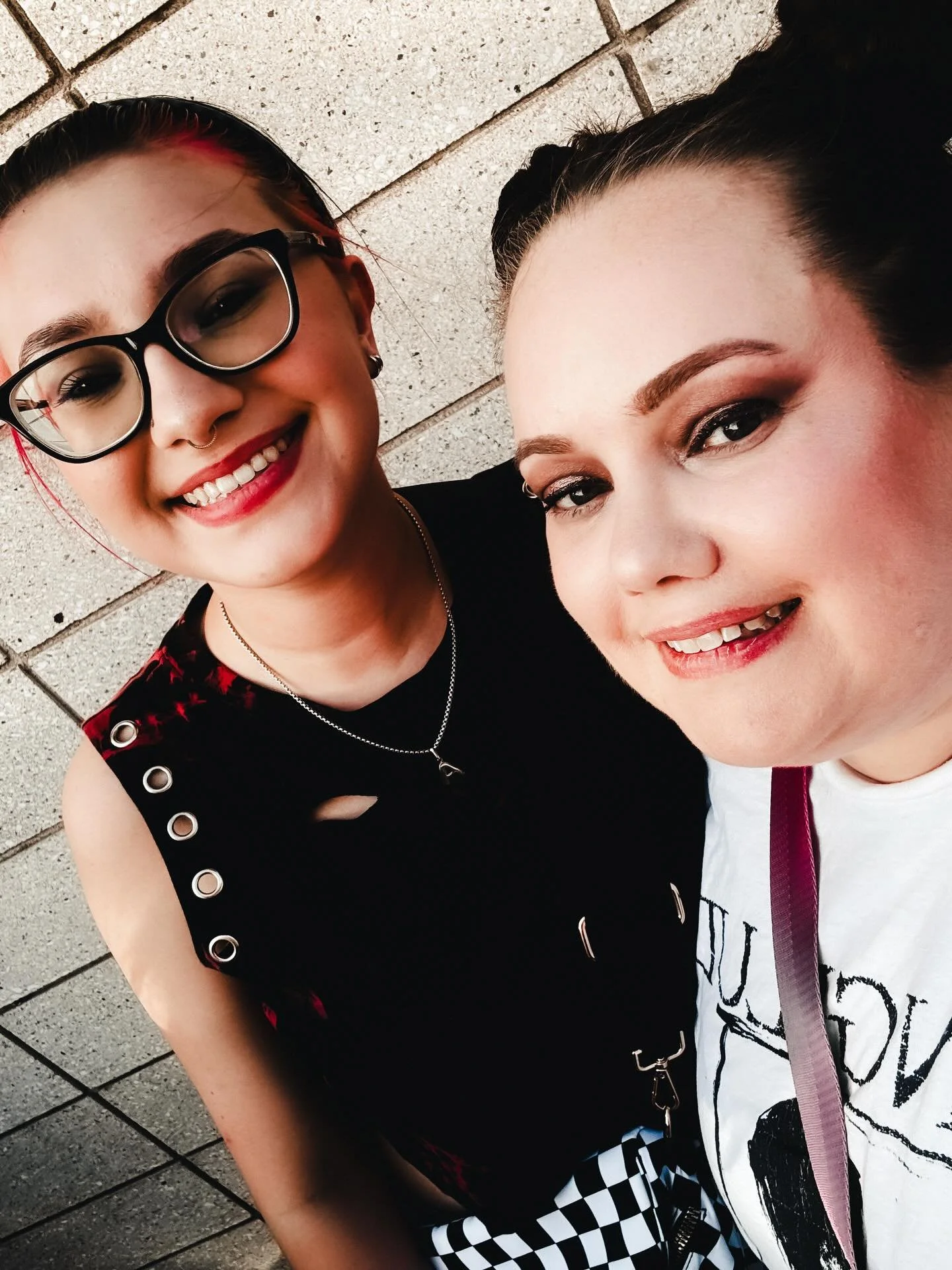 Teaching her the important things in life: scream the lyrics, wear the outfit, and never miss a good concert. 🕷️