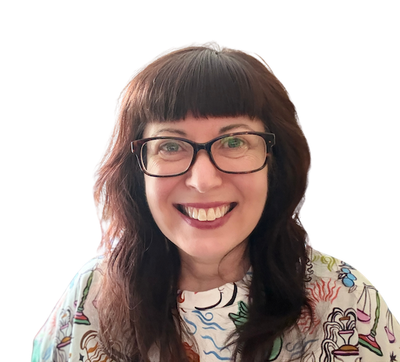 A woman with glasses smiling, wearing a colorful patterned shirt, with shoulder-length brown hair and bangs.