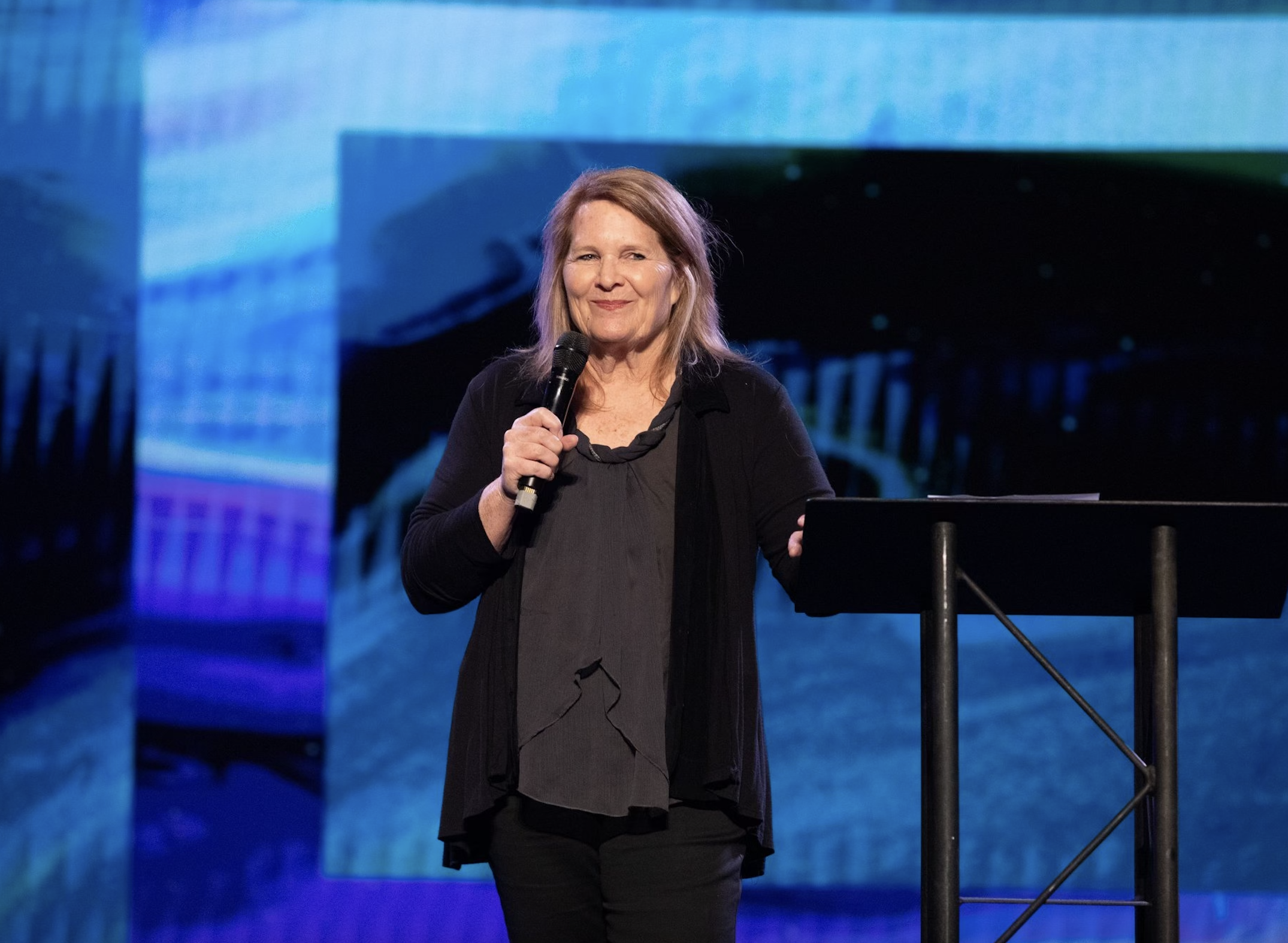 Cindy is speaking at an even.