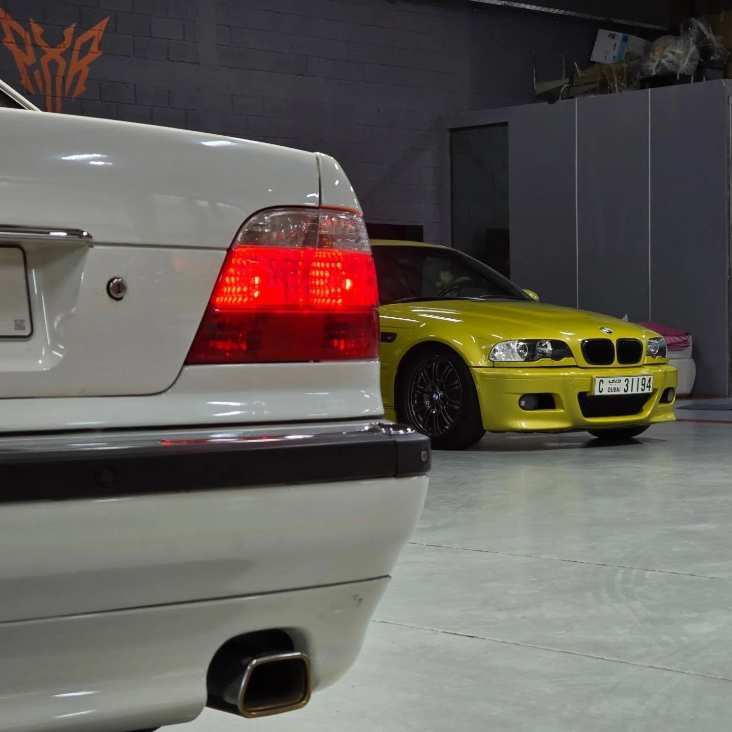 The early 2000s BMW era had a soul of its own.

An E38 750iL and an E46 M3 in the shop is the kind of sight that never gets old. These new-timers carry presence, character, and the kind of driving feel that made people fall in love with the brand in 