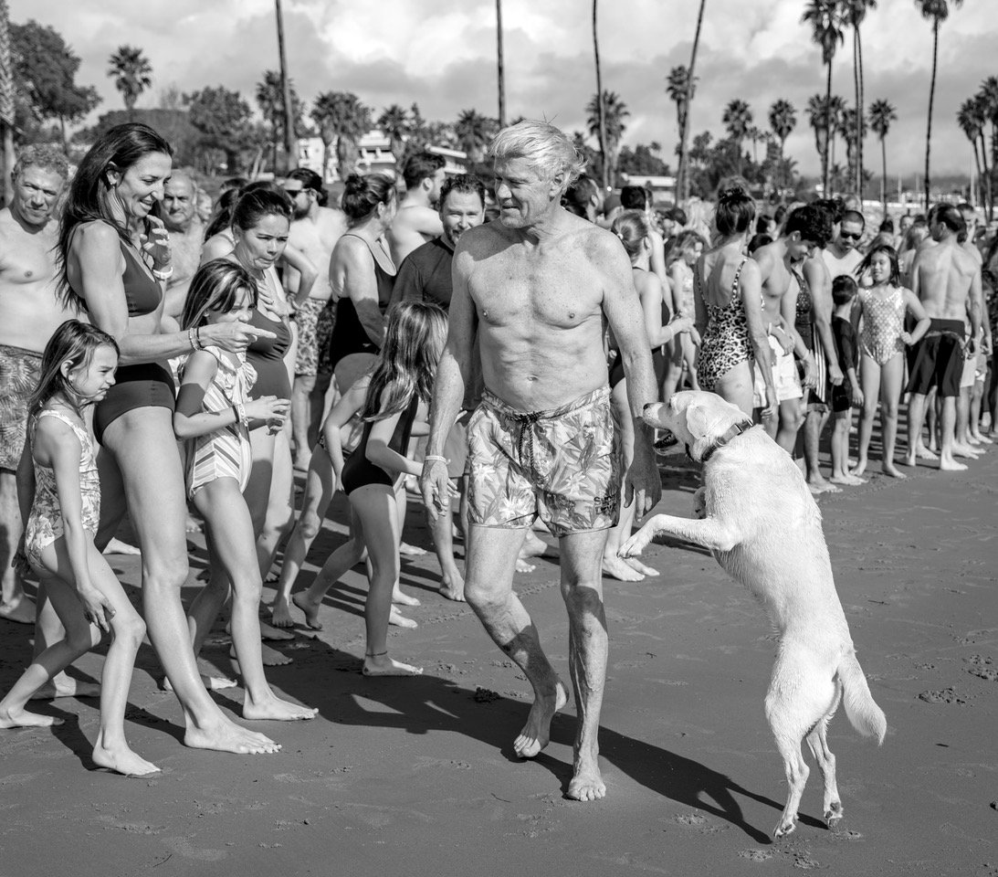 Man with labrador passes girls bnw.jpeg