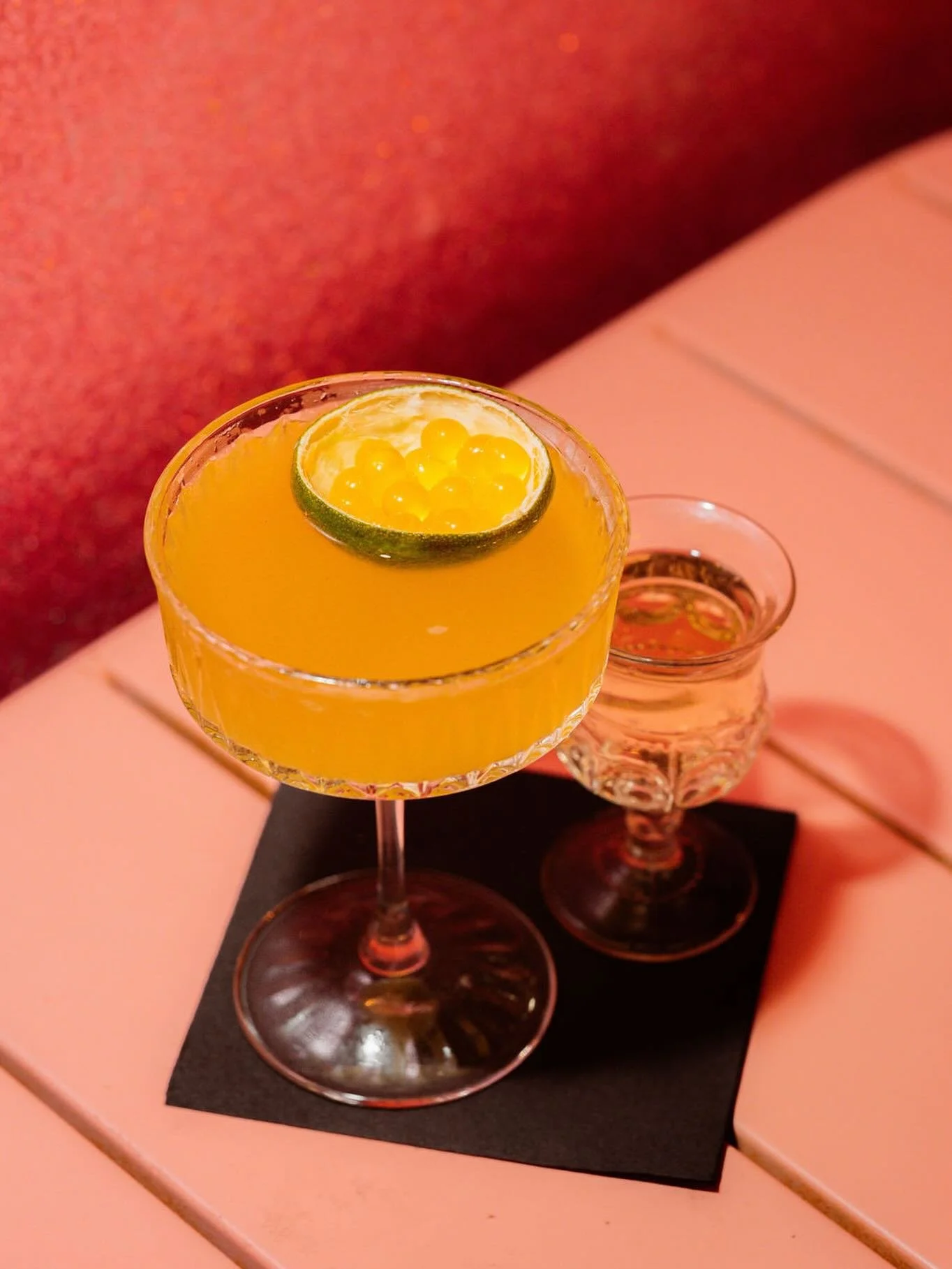 ✨Every pornstar needs a side car✨
Created in the early 2000s by Douglas Ankrah, passion fruit liqueur, house made vanilla syrup, fresh lime juice and vodka cocktail is a modern classic. Side cars are little bonus drinks that come with your drink, pop