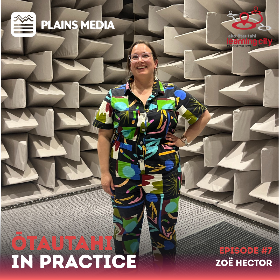 Zoë standing with her hand on her hip inside an anechoic chamber 