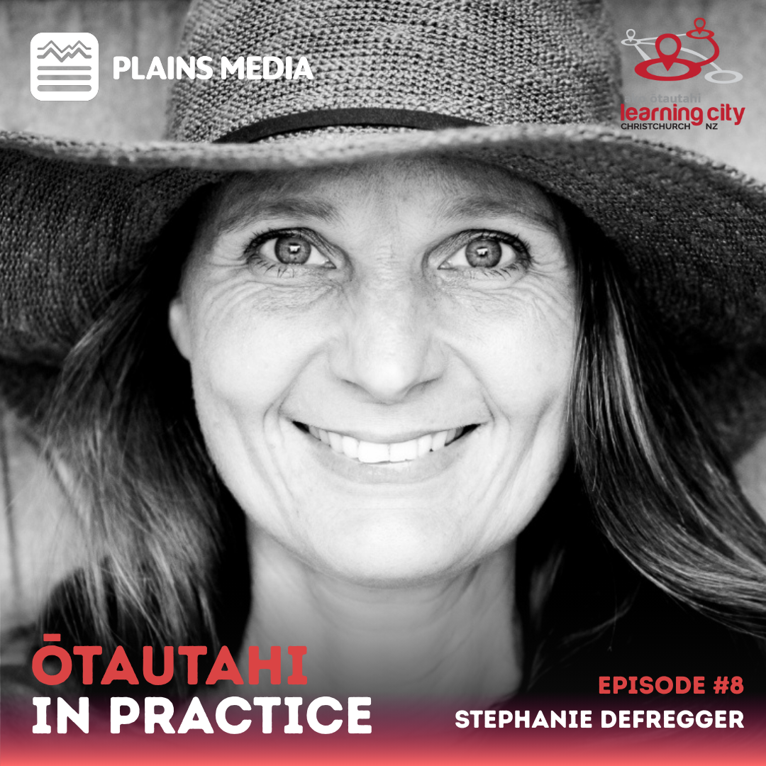 Stephanie smiles directly at us through the camera.