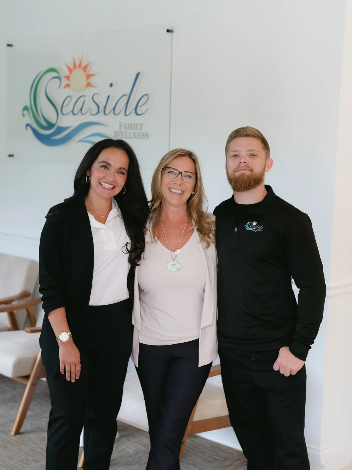 Seaside Family Wellness team standing together inside Port St. Lucie primary care clinic.