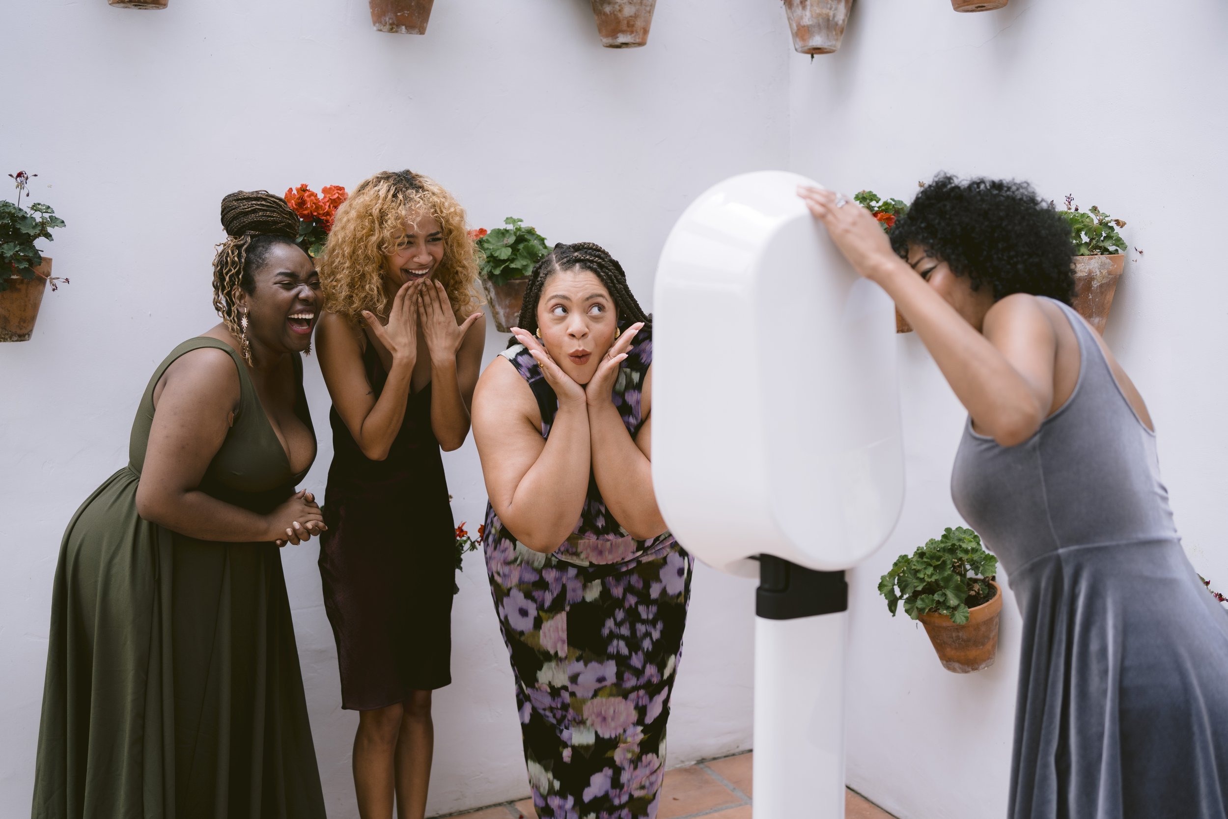 Group of guests posing in front of a digital photo booth rental at a Berkshire County