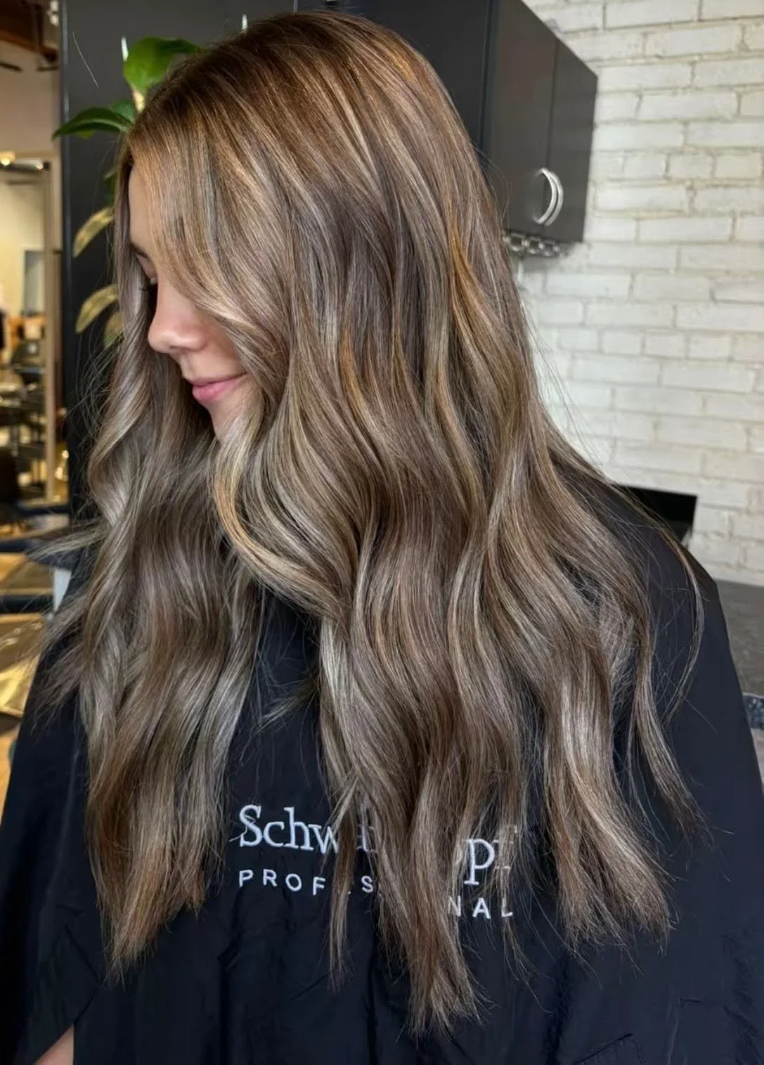 Dimensional brunette balayage hairstyle at Studio M Aesthetics.