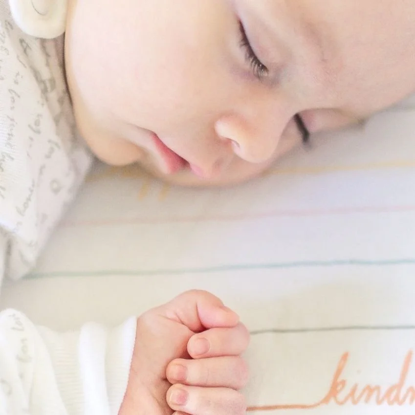 Sleeping baby after Raising Sleepers sleep training with a personalized sleep plan and bedtime routine.