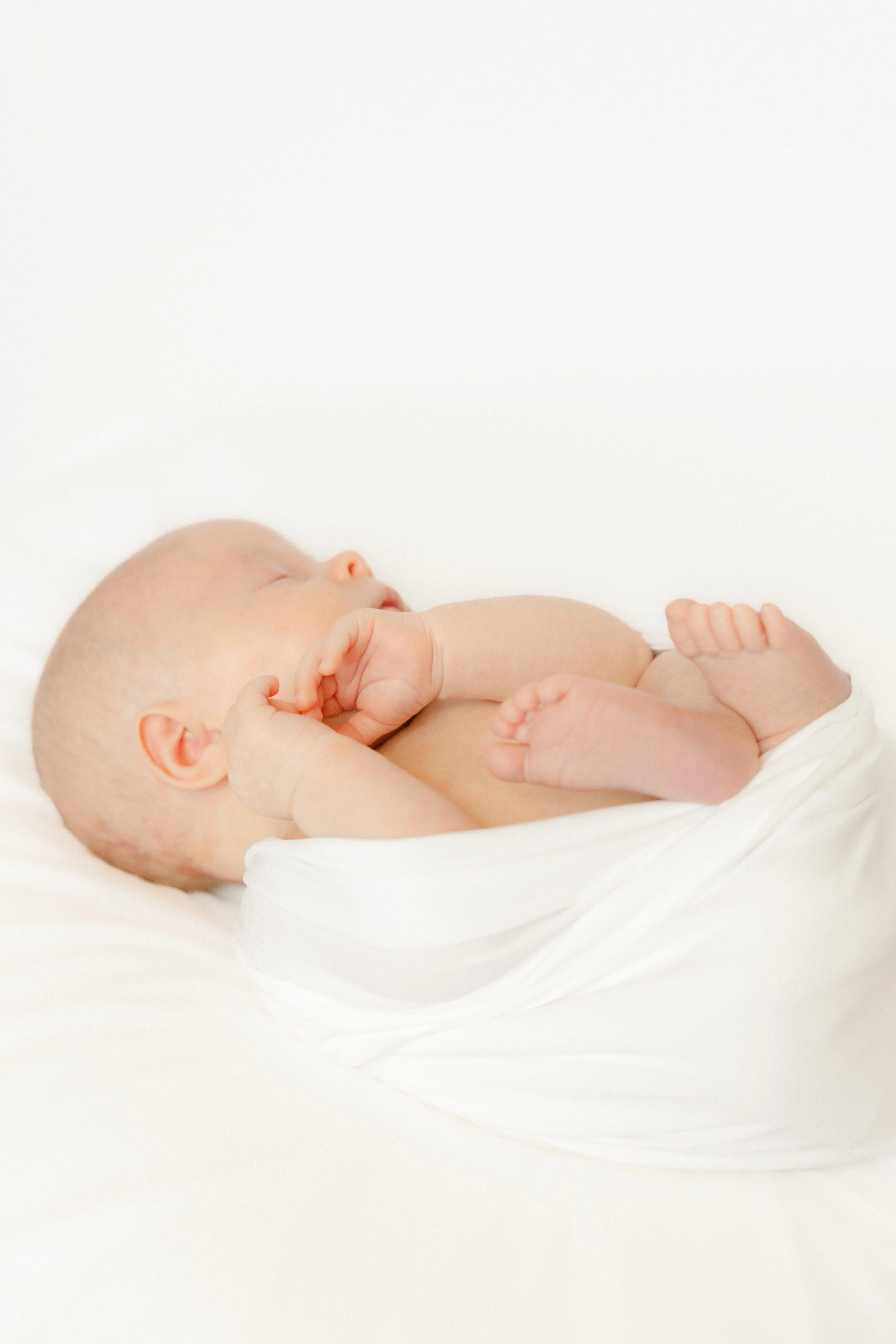 NewbornbabySessionLisbonNewbornPhotographerSwaddledBaby.jpg