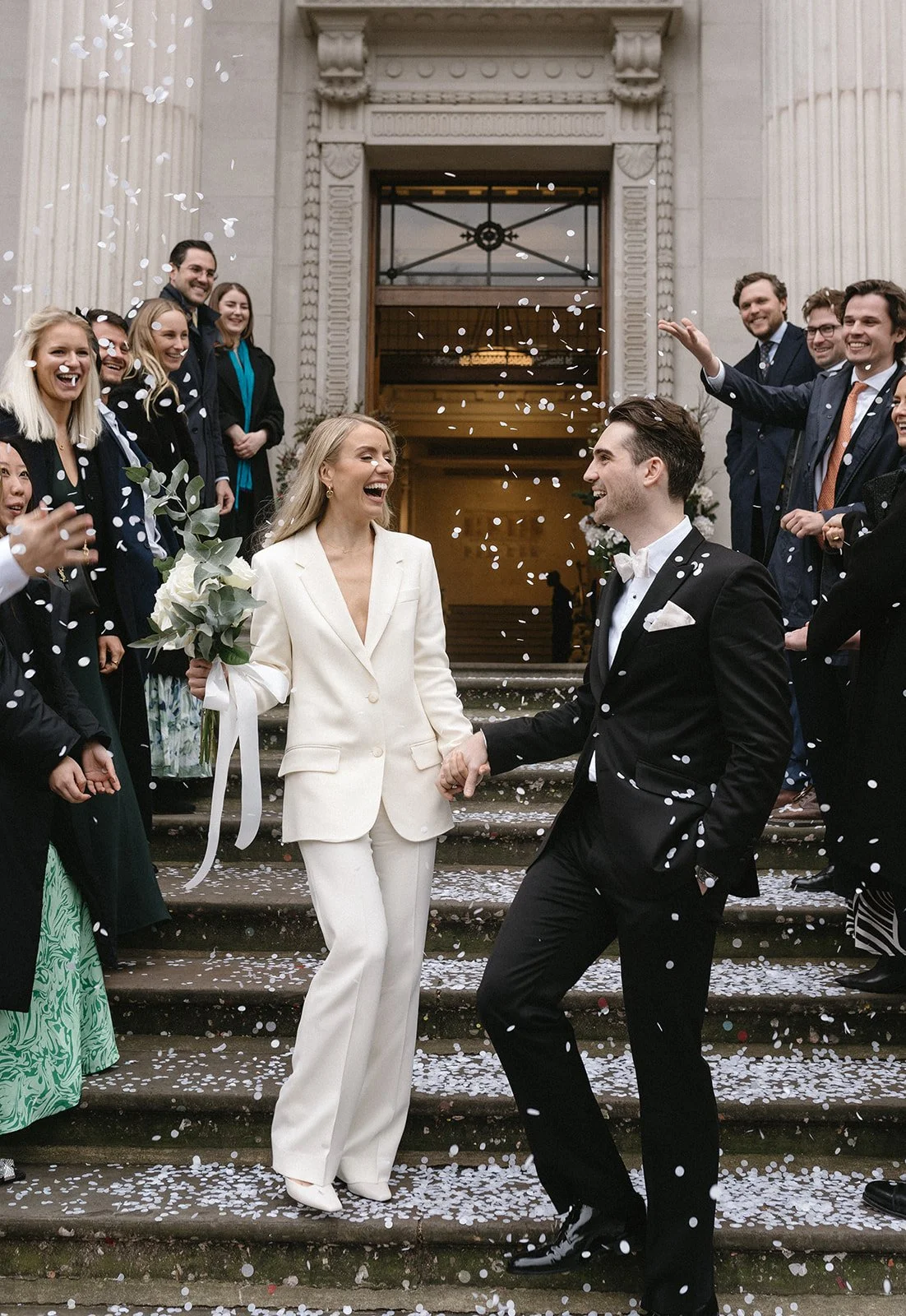 confetti-toss-cream-suit-bride.jpg