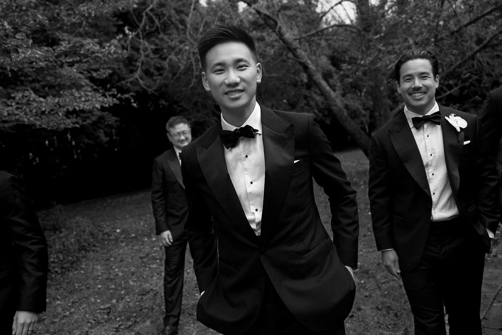 groom-groomsmen-candid-garden-walk.jpg