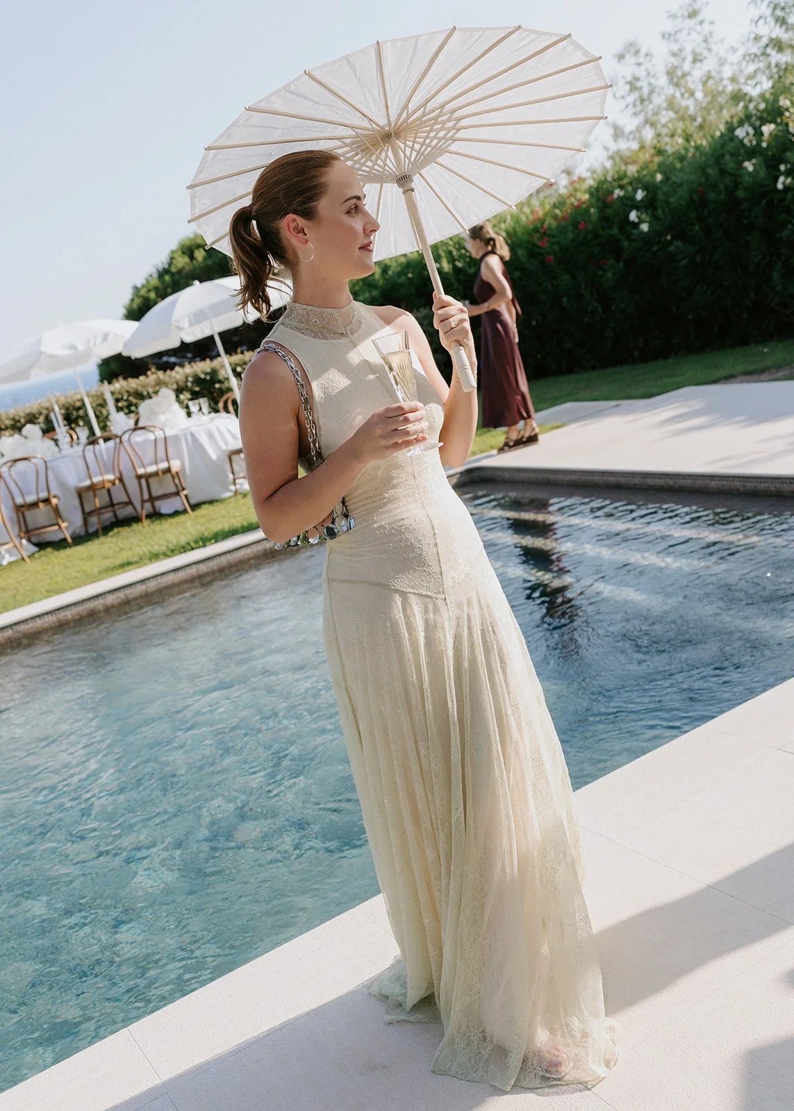 cream-lace-dress-poolside-parasol.jpg