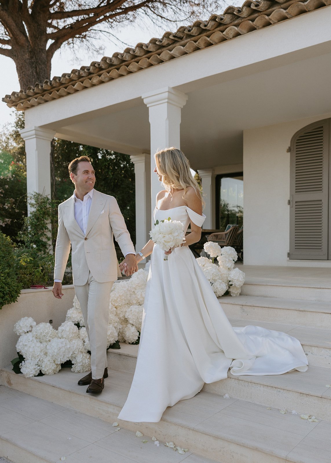 bride-groom-walking-villa-steps.jpg