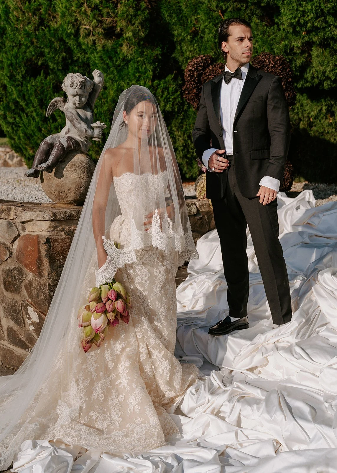 bride-groom-portrait-cherub-statue.jpg