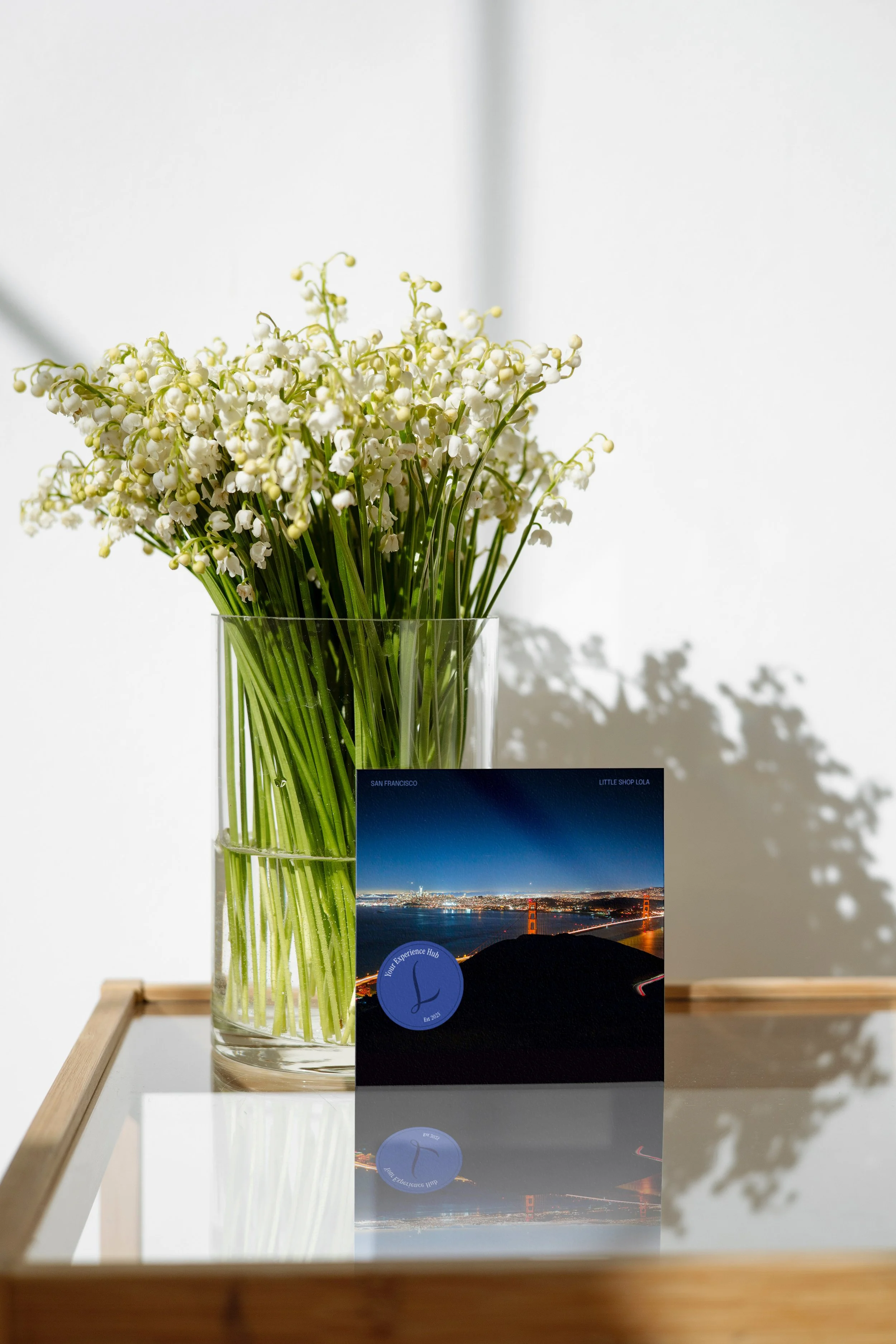 44165061_square_mockup_sheet_with_reflection_and_bouquet_of_lilies_of_the_valley copy.jpg