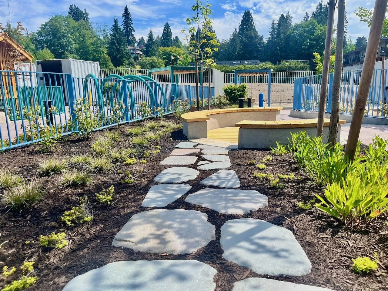 Image of stone path leading to benches in West Vancouver ECEC.