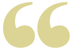 A large, stylized quotation mark symbol in light lime green.