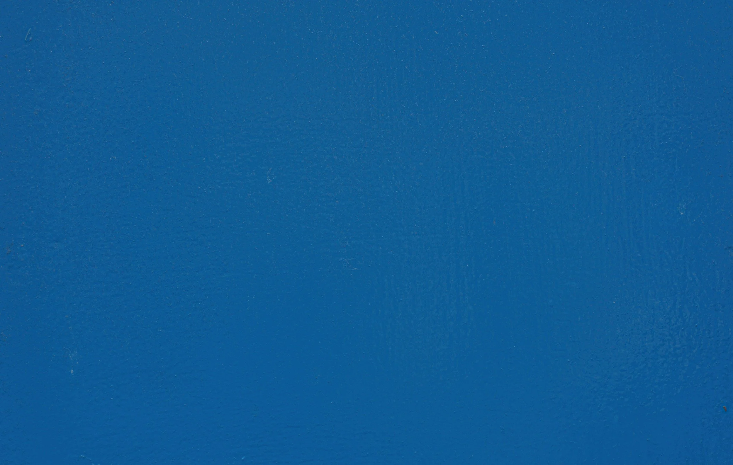 Solid blue background with slight texture.