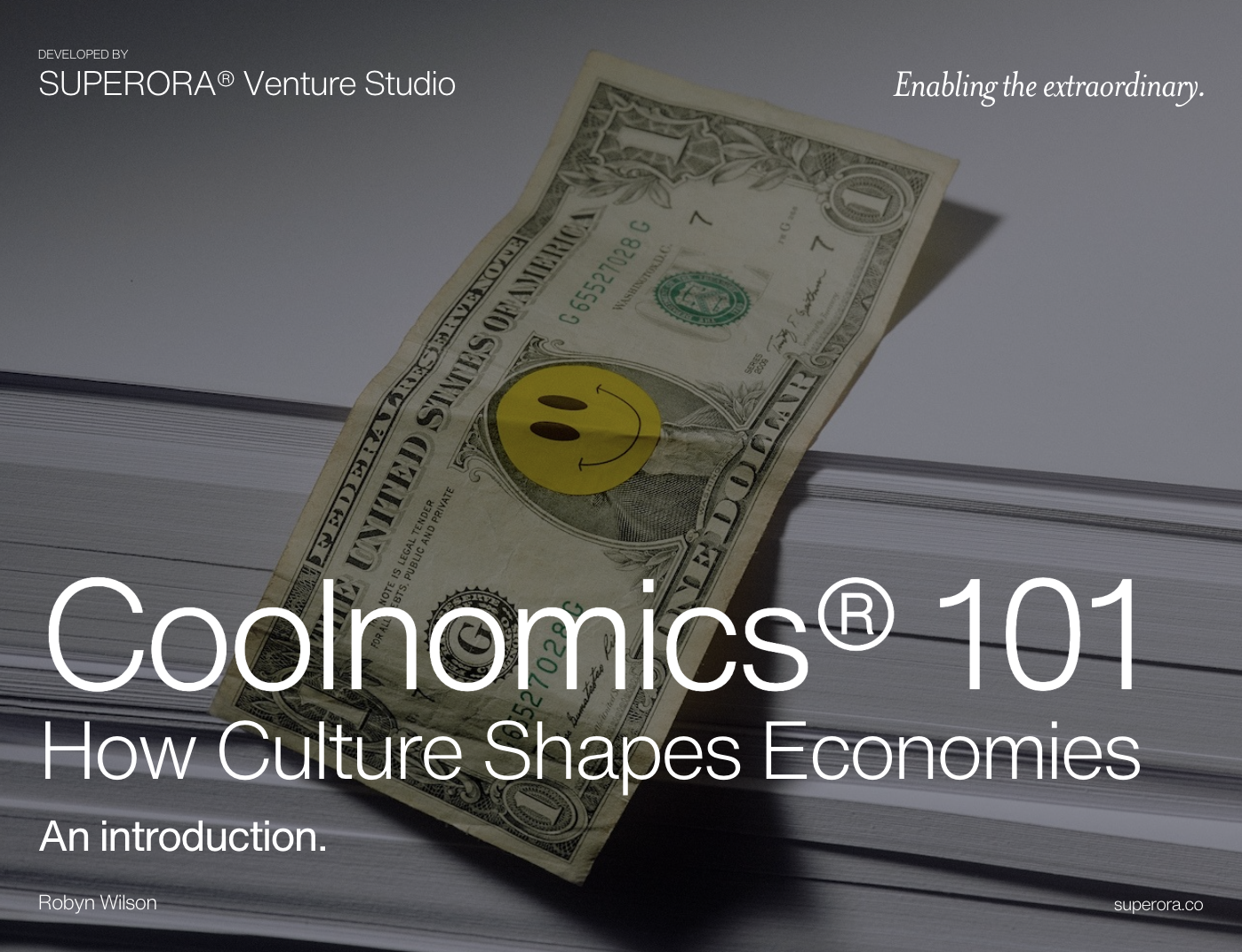 A dollar bill with a smiling yellow circle sticker rests on a stack of papers. Text overlay reads: "Coolnomics® 101: How Culture Shapes Economies. An introduction." Developed by Superora® Strategy Studio. Robyn Wilson. Website: superora.co.