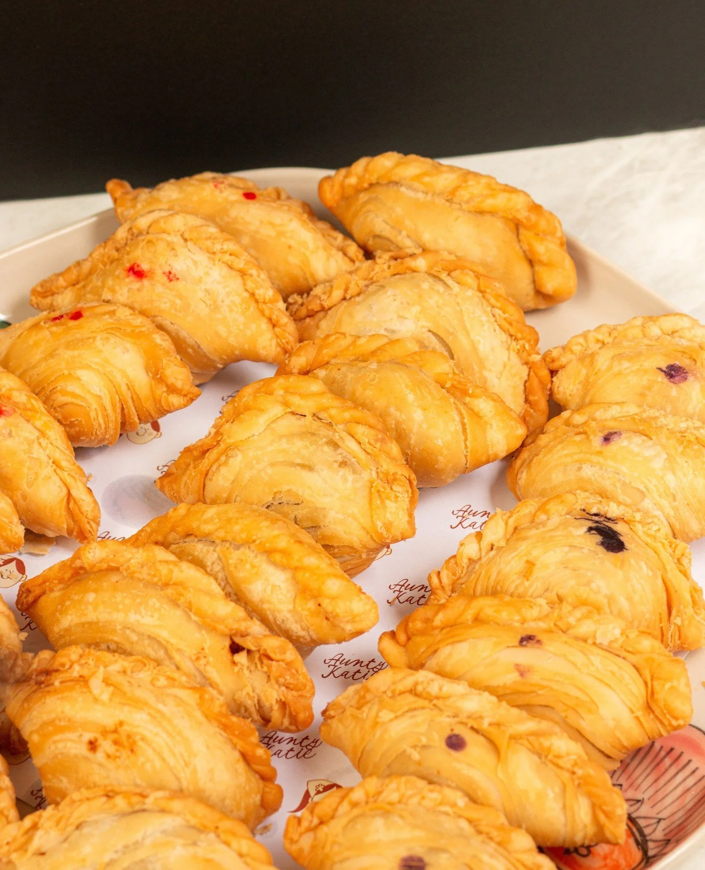 Golden, flaky, and straight out of Aunty&rsquo;s kitchen 🥟🤍 Our Curry Puffs are crisp on the outside with a warm, comforting filling, with your choice from Chicken, Red Pork, or Taro.⁠
⁠
Bookings &amp; takeaways via www.auntykatie.com.au/