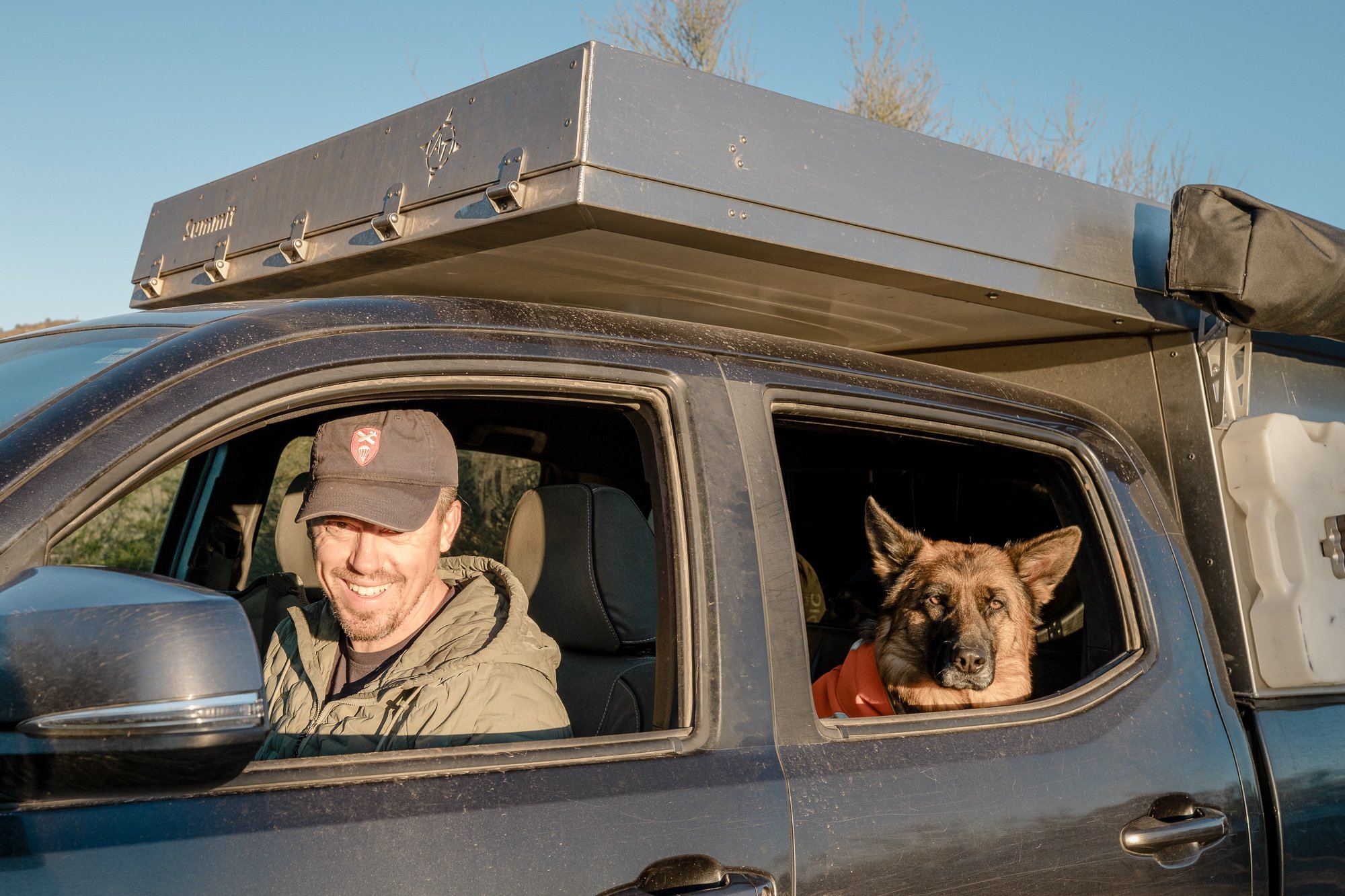 Man-dog-camper-overlanding-AT-overland-travel.jpeg