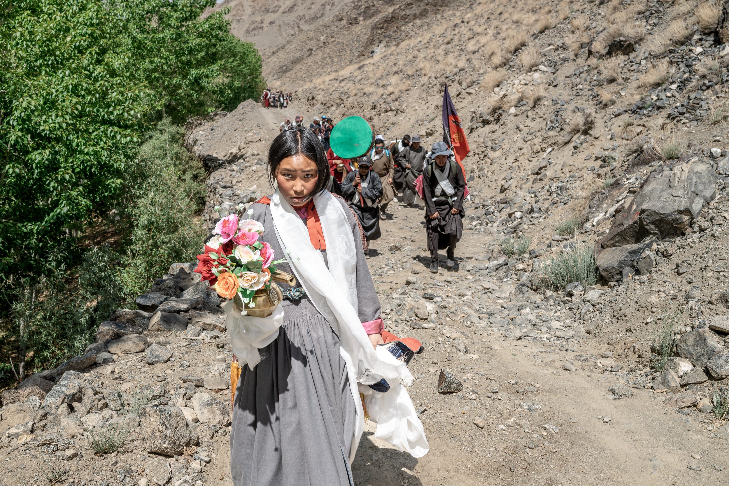 ladakh-bungskor-water-ceremony-procession-nang-village-girl-flowers.jpg