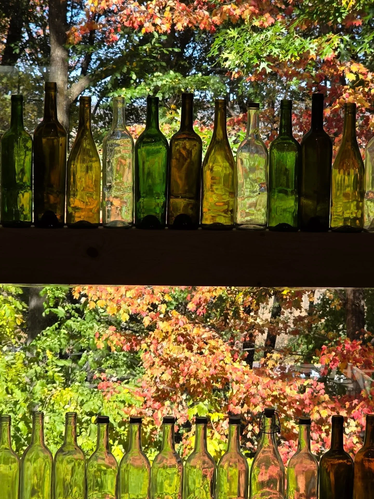Behind the Workbench.
Every bottle on that shelf is future product. We don&rsquo;t buy &ldquo;stock.&rdquo; We build it &mdash; cut, wire, and finish each piece by hand in-shop. What you&rsquo;re looking at is raw material waiting to earn a second li