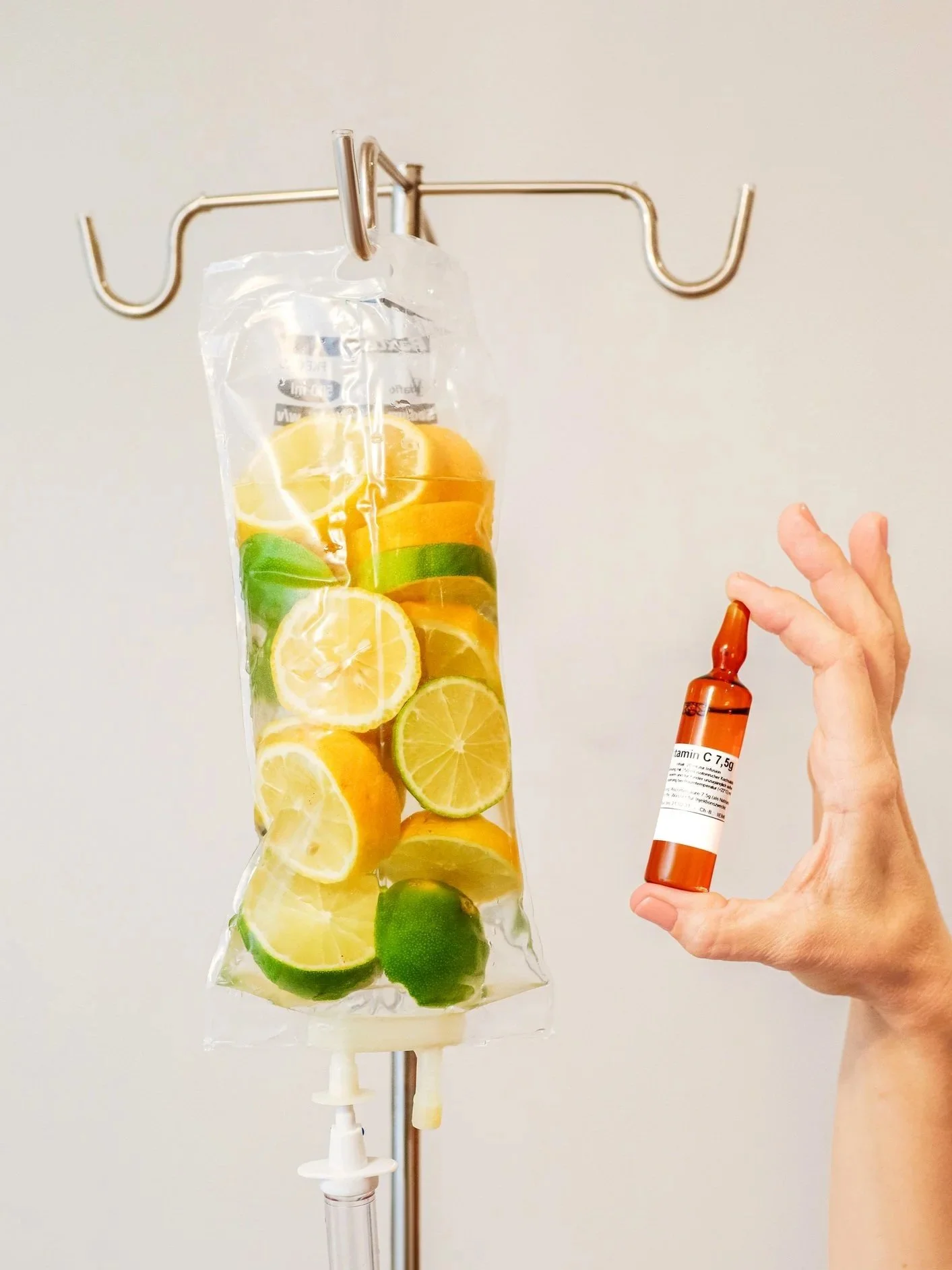IV bag filled with citrus fruits, representing immune support and hydration.