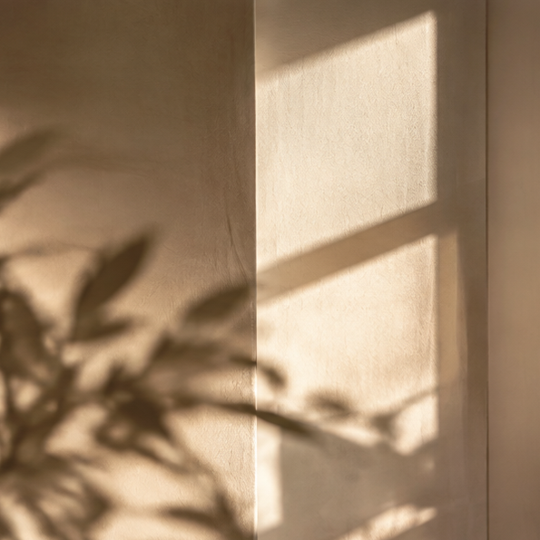 Soft abstract light and shadow pattern representing wellness and vitality.