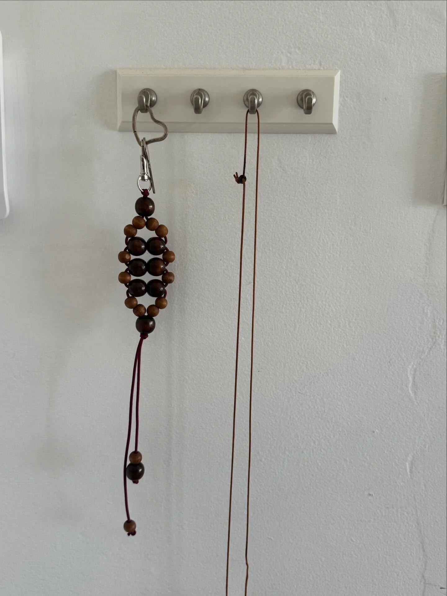 wooden beads and with elastic cord key chain! these are so fun to make i&rsquo;m addicted 

they&rsquo;re a good keychain as they are durable and can be used as a fidget 

#beading#woodenbeads#macrame