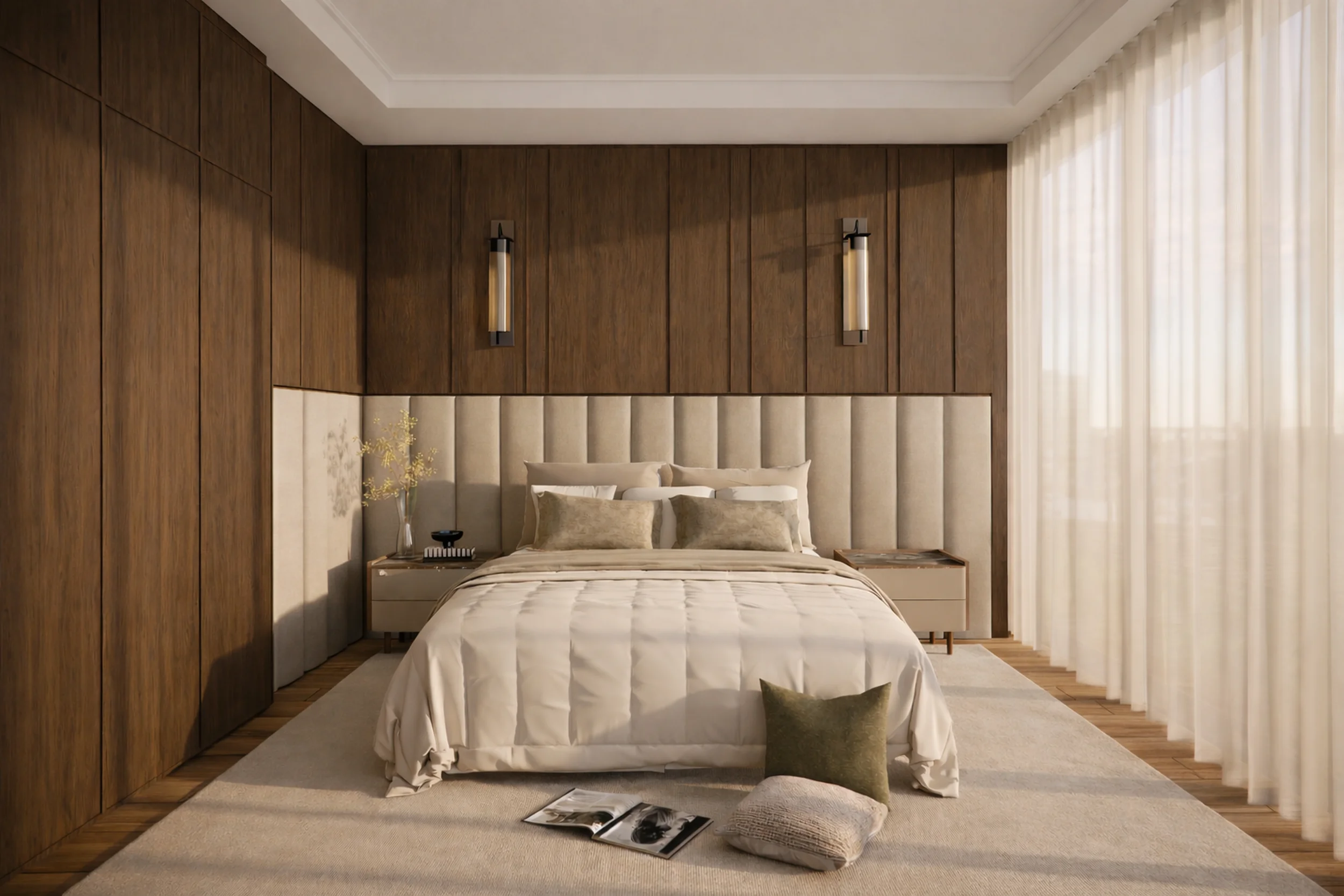 Modern bedroom with beige upholstered headboard, wooden wall panels, and floor-to-ceiling white curtains, decorated with pillows, a lamp, a side table, and an open magazine on the floor.