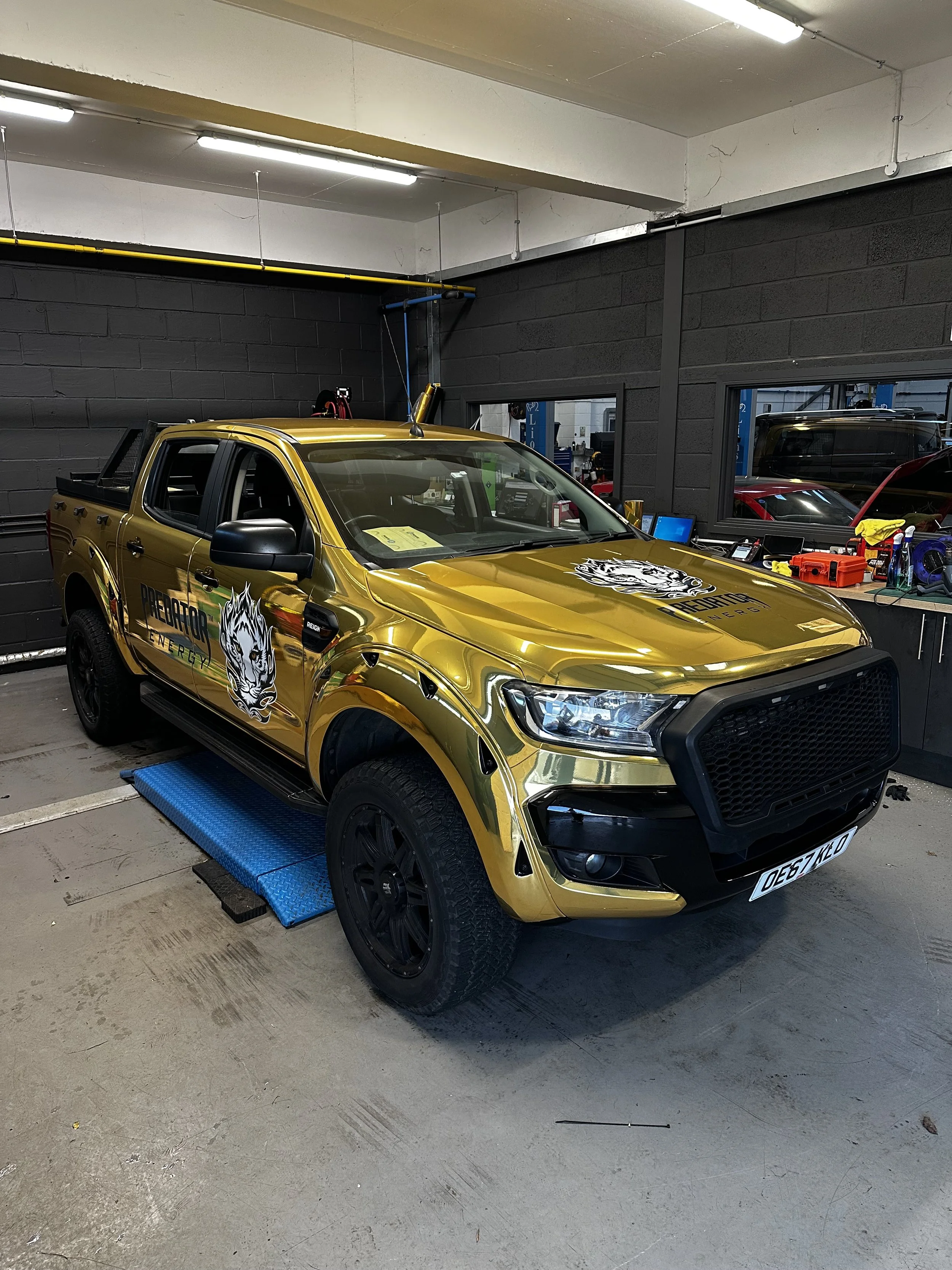 Avery Denison gold chrome wrap on a ford ranger for predator energy drink "monster energy"