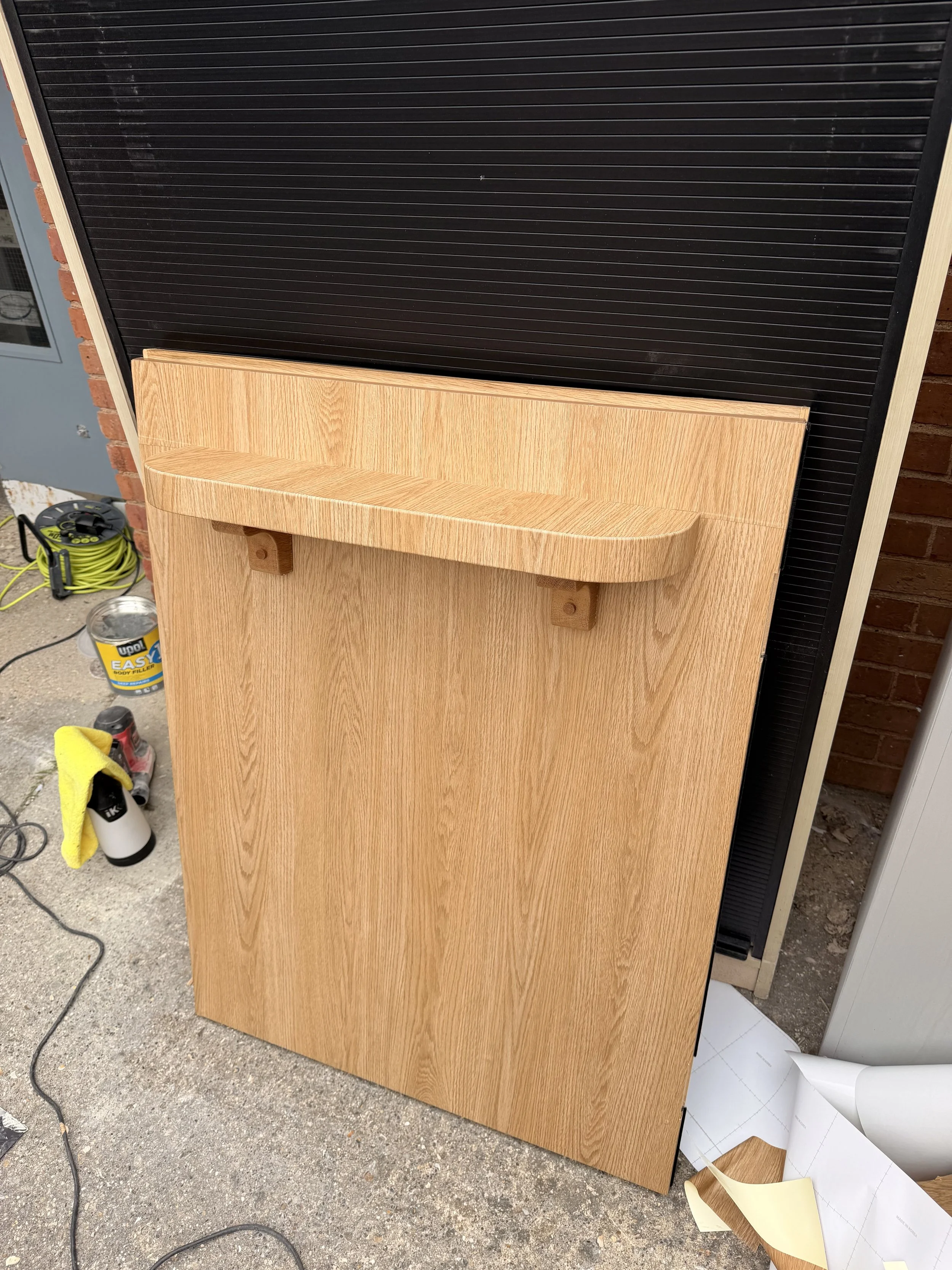 service door with shelf refurbished with architectural wrap.