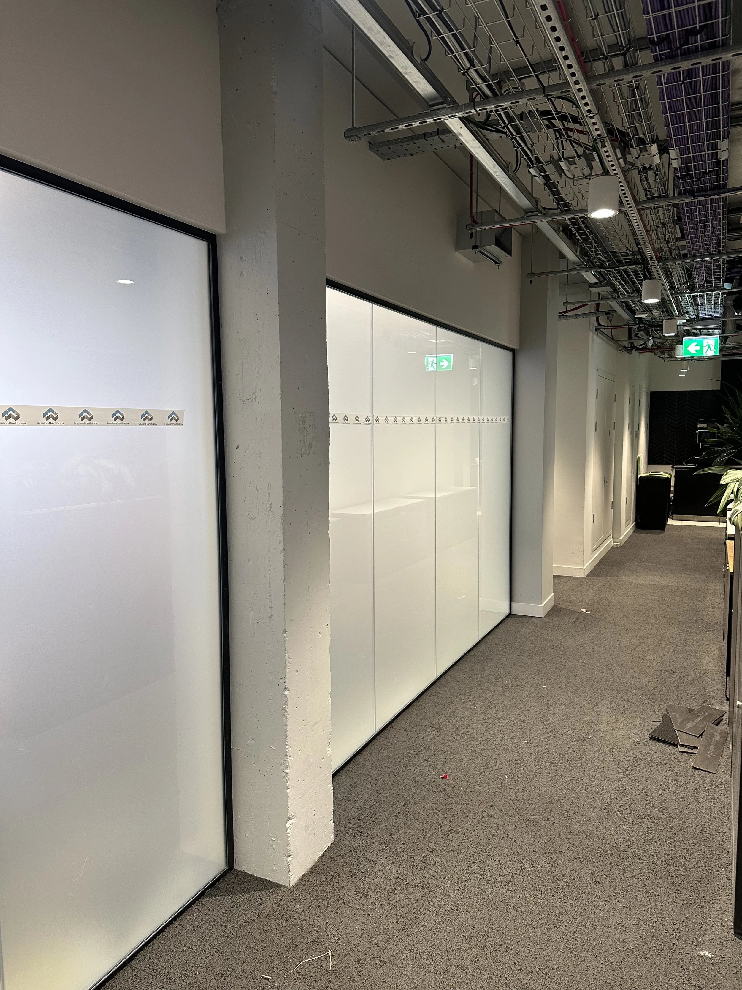 office dividing windows with frosting applied for privacy.