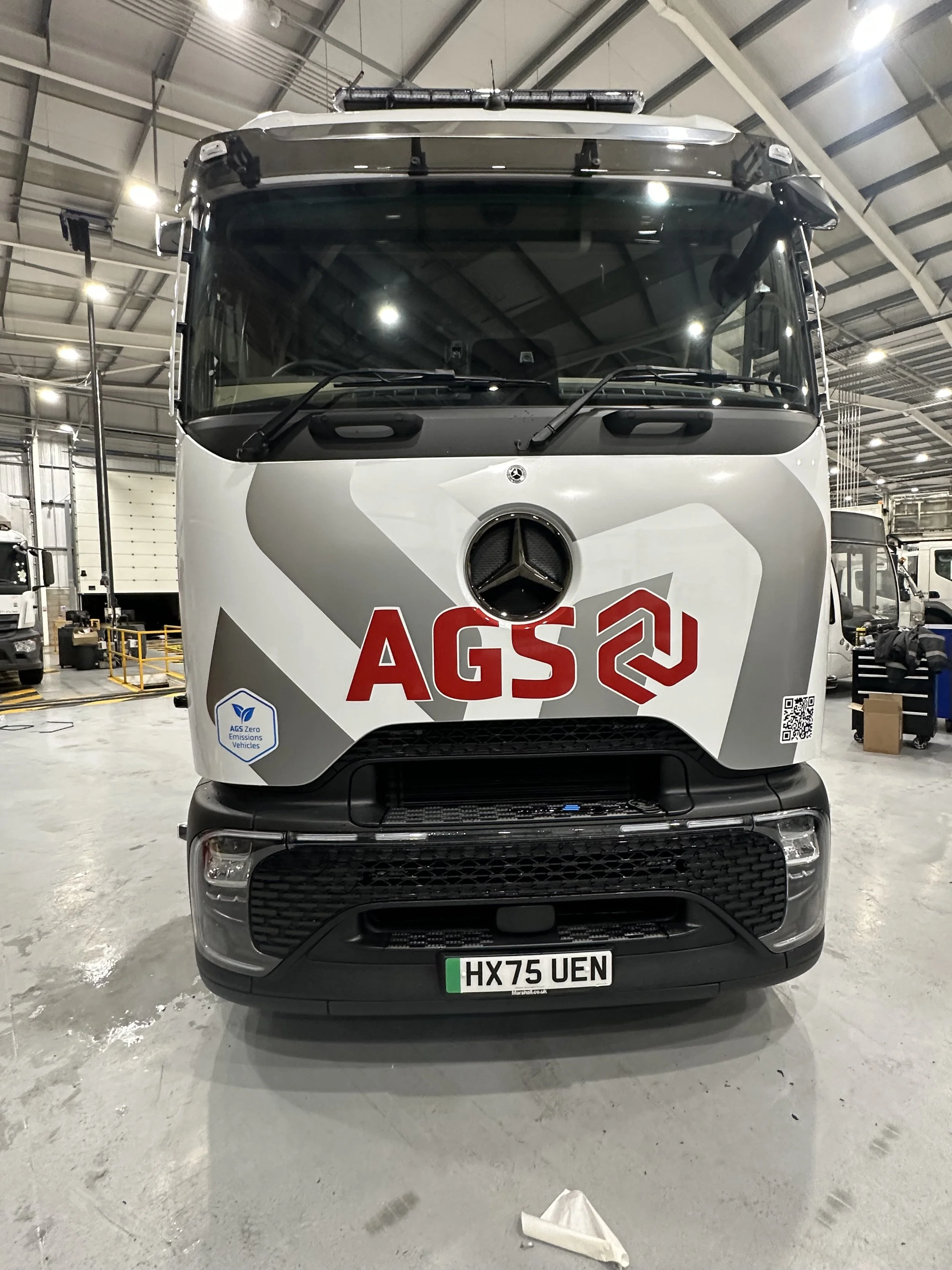 Front view of a Mercedes-Benz electric sign written with the AGS logo automania garage services.