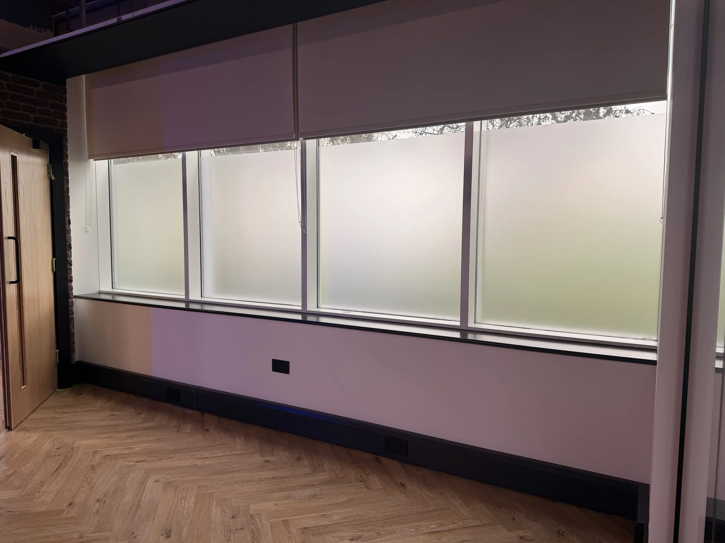 window frosting for privacy at a gym while still letting some natural light in.