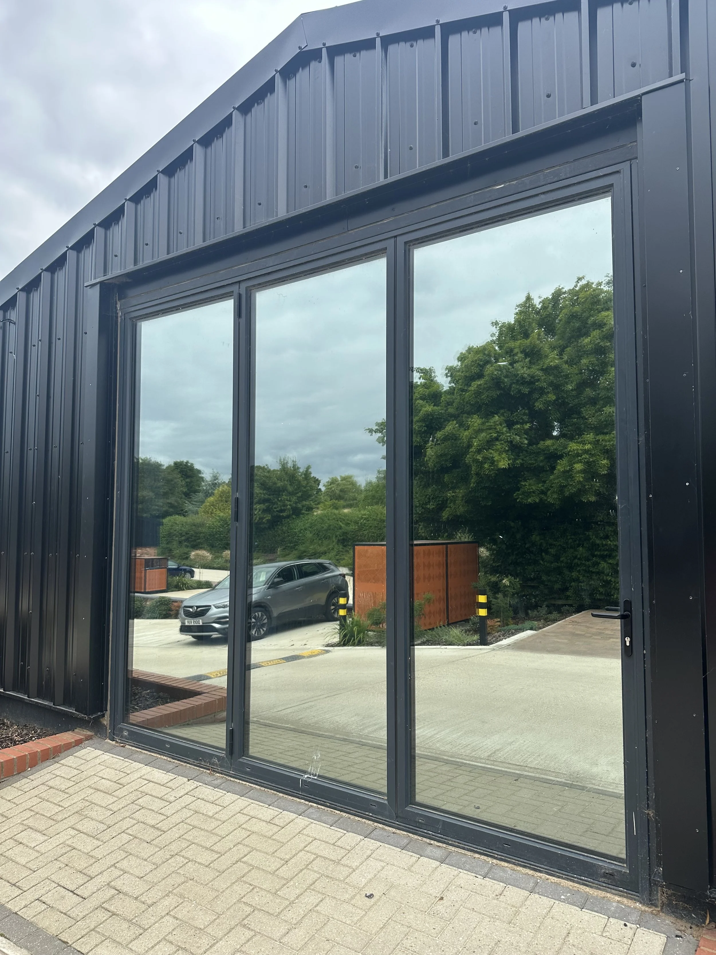 large glass with reflective window film for privacy.