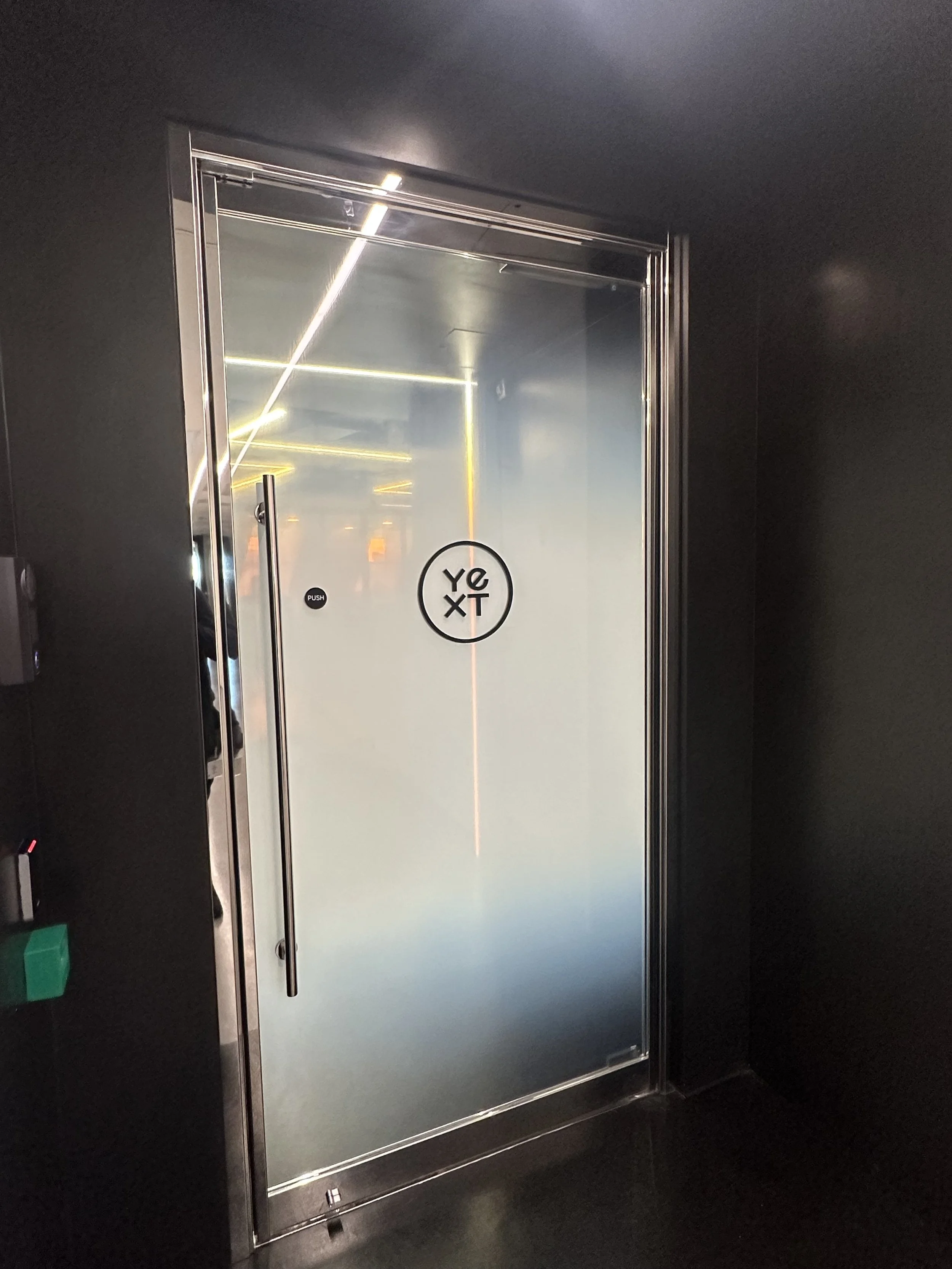Faded window film applied for privacy on an entrance door.
