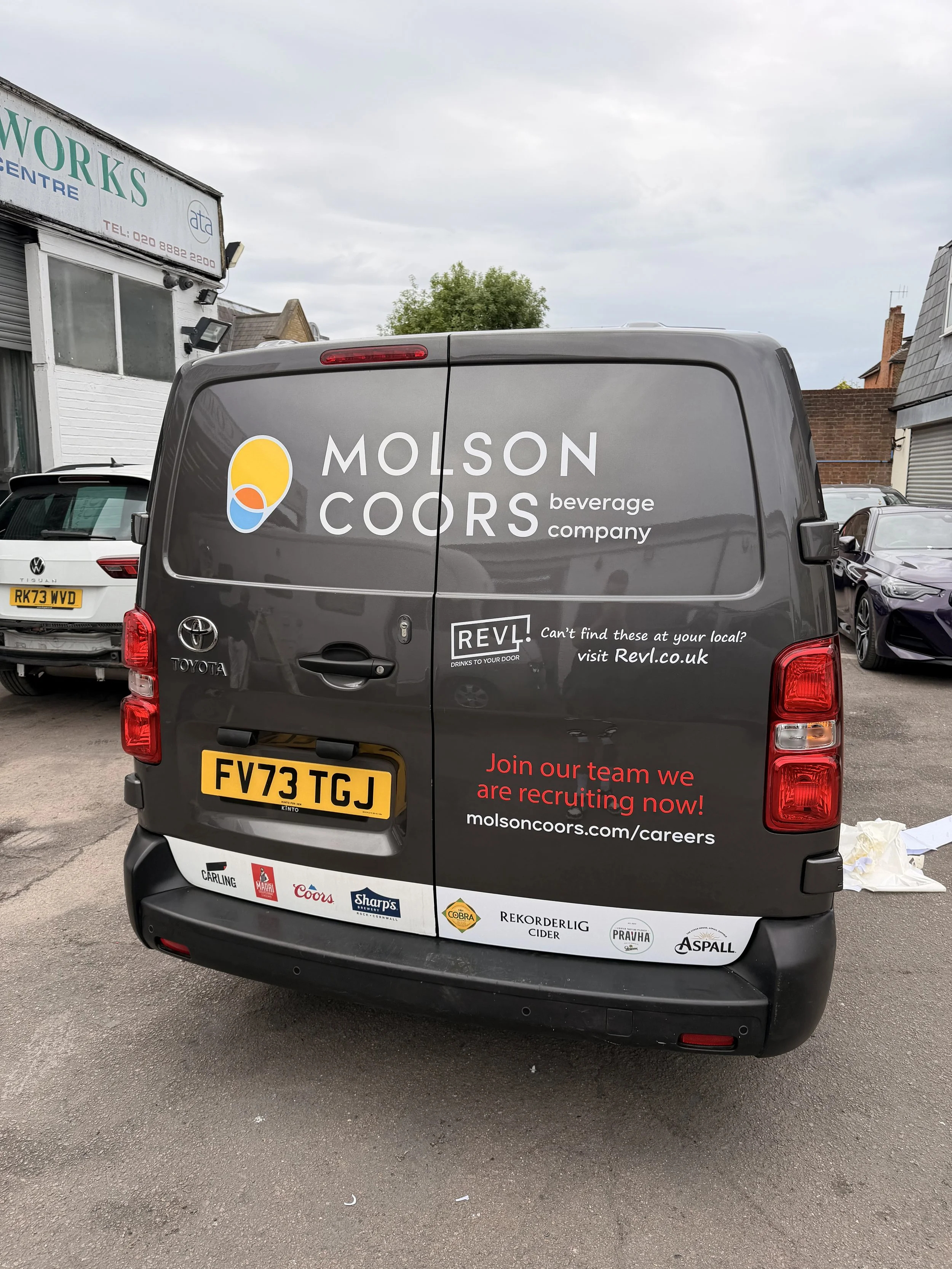 rear door crash repair to the sign writing for Molson coors.
