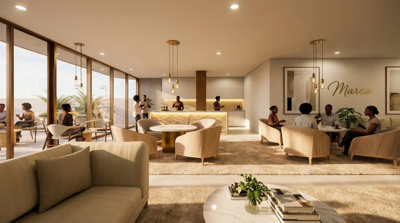 Modern hotel lounge with large windows, beige sofas, wooden chairs, and a marble-topped bar. People are seated and standing, socializing and ordering drinks. Artwork and plants adorn the walls.