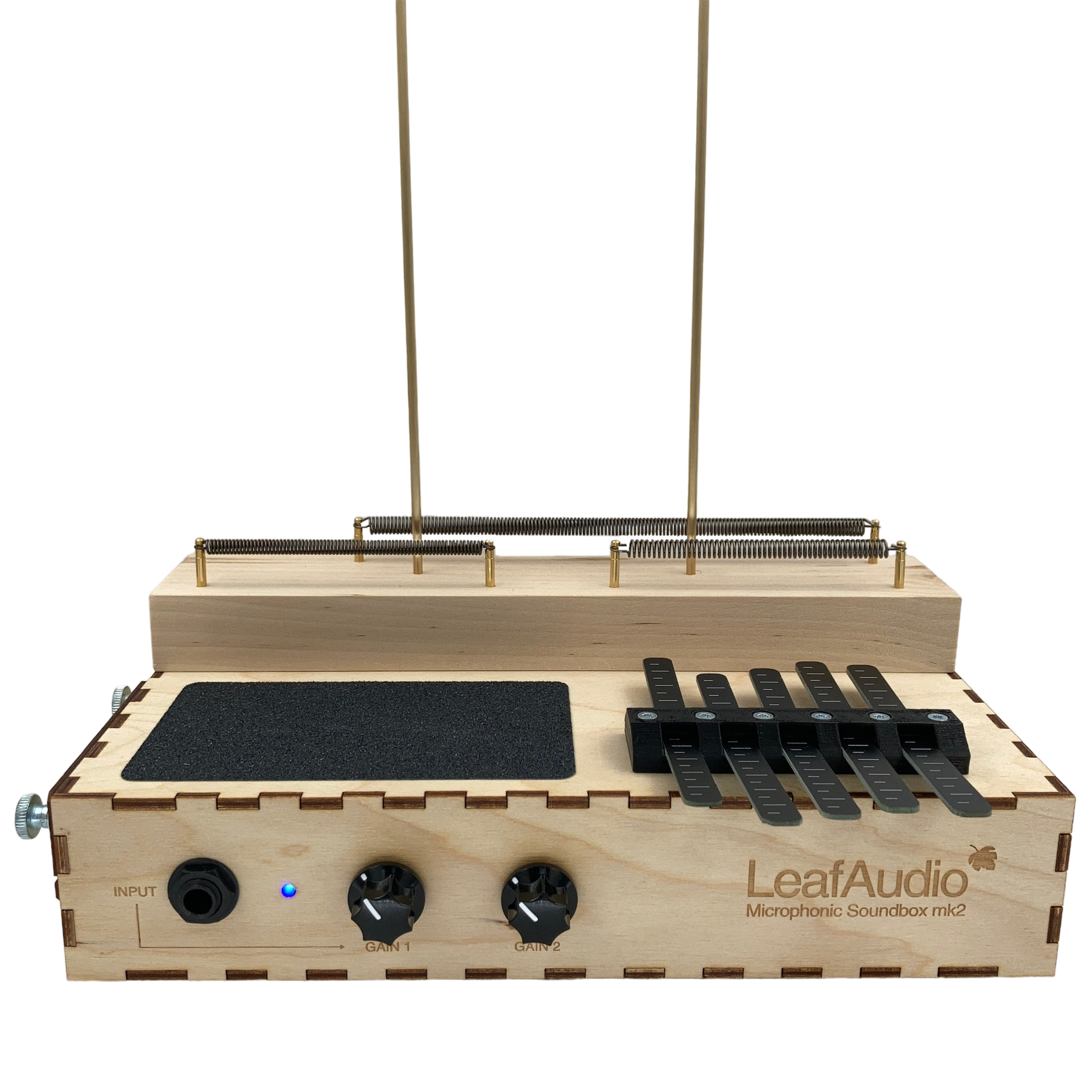 LeafAudio Microphonic Soundbox mk2, a wooden-based musical instrument with spring mechanisms, control knobs, input jack, and a kalimba.