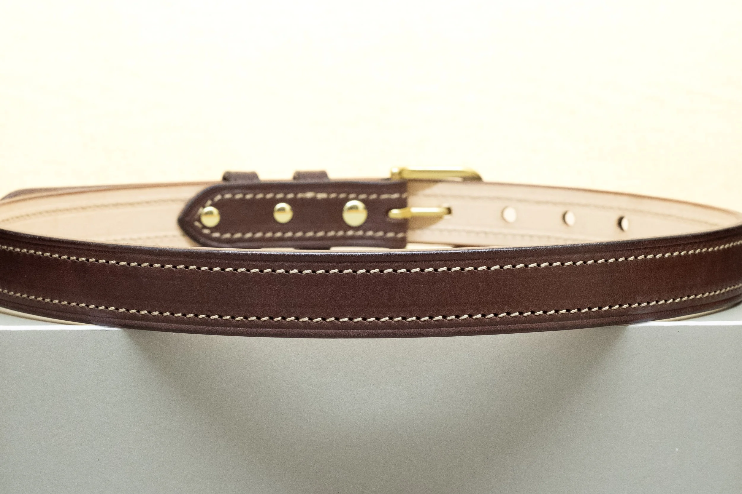 Dark brown bridle leather belt with contrast natural stitch and half brass buckle 25mm