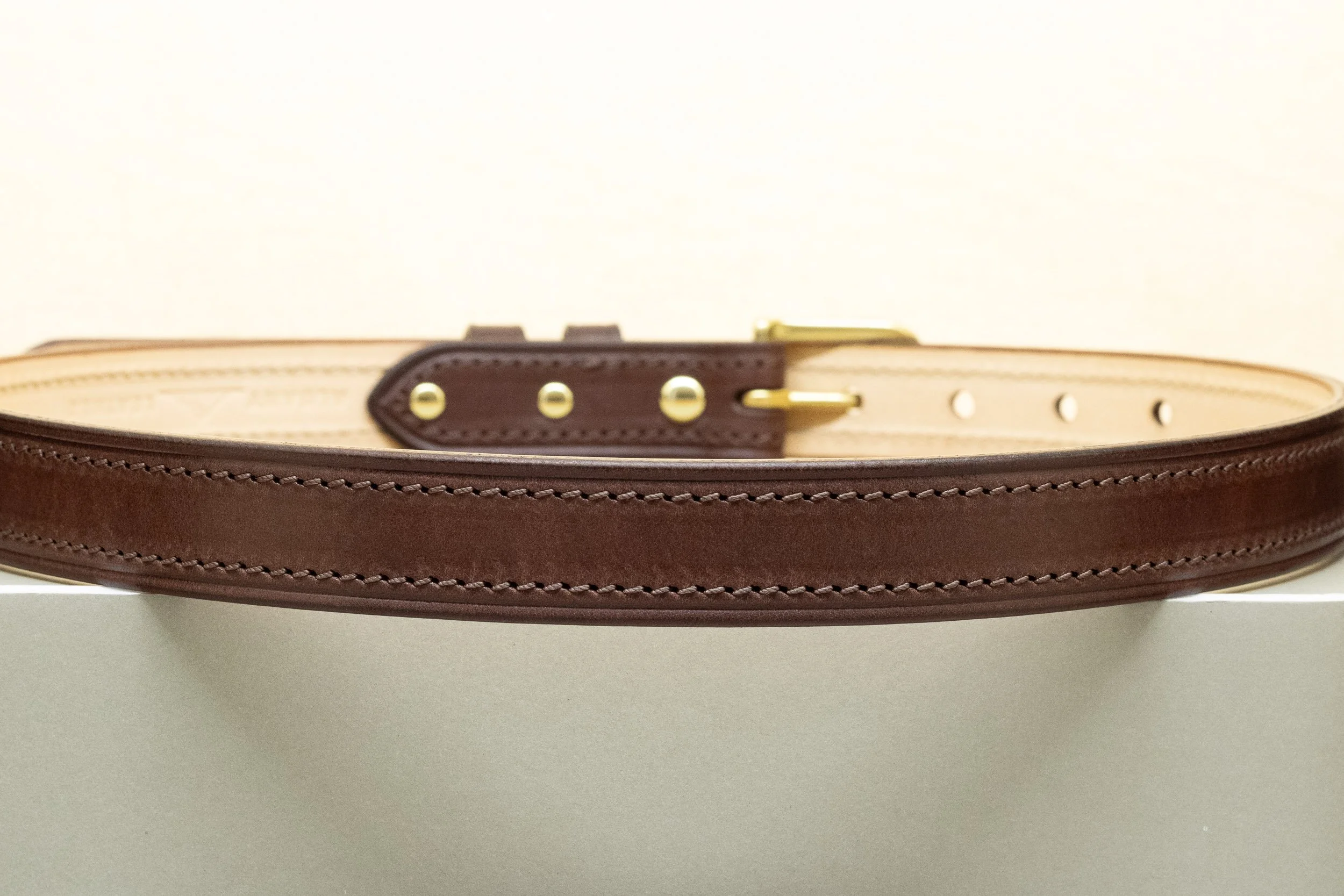 Dark brown bridle leather belt with matching brown stitch and half brass buckle 25mm