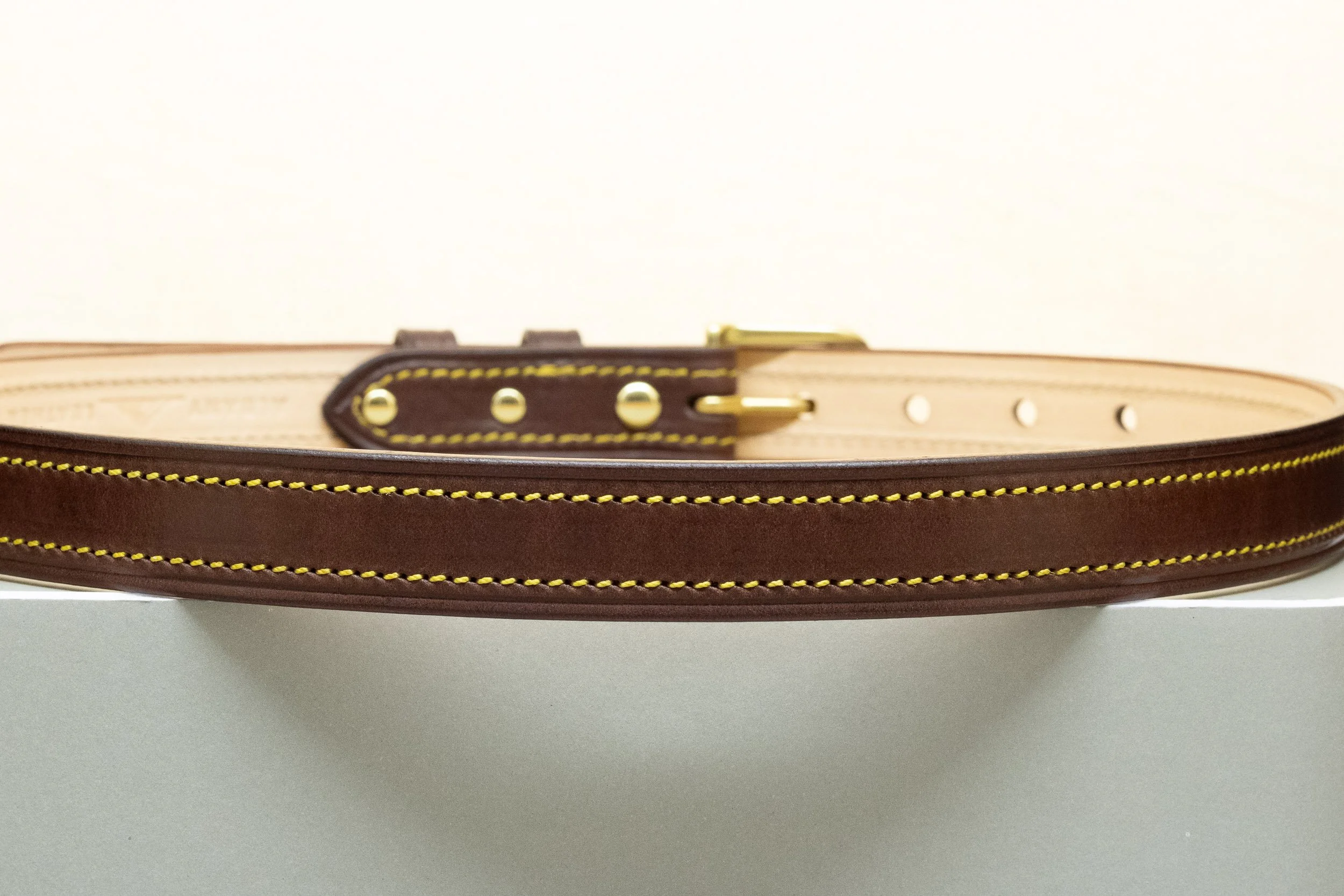 Dark brown bridle leather belt with yellow stitch and half brass buckle 25mm