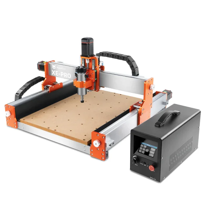 A CNC woodworking router with a black and orange frame, a drill head in the center, a digital control panel on the right, and a black dust collection hose on top.