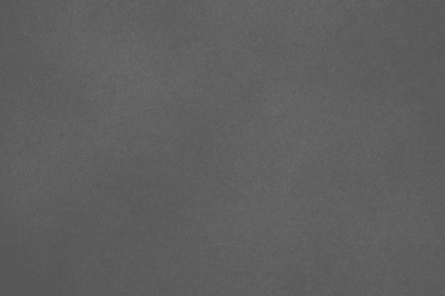 Solid gray textured background with no distinguishable objects or features.