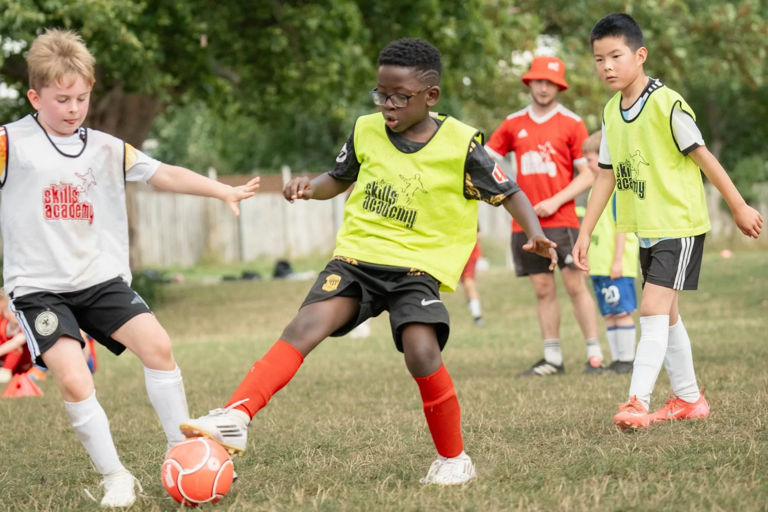 A group of children playing football together
