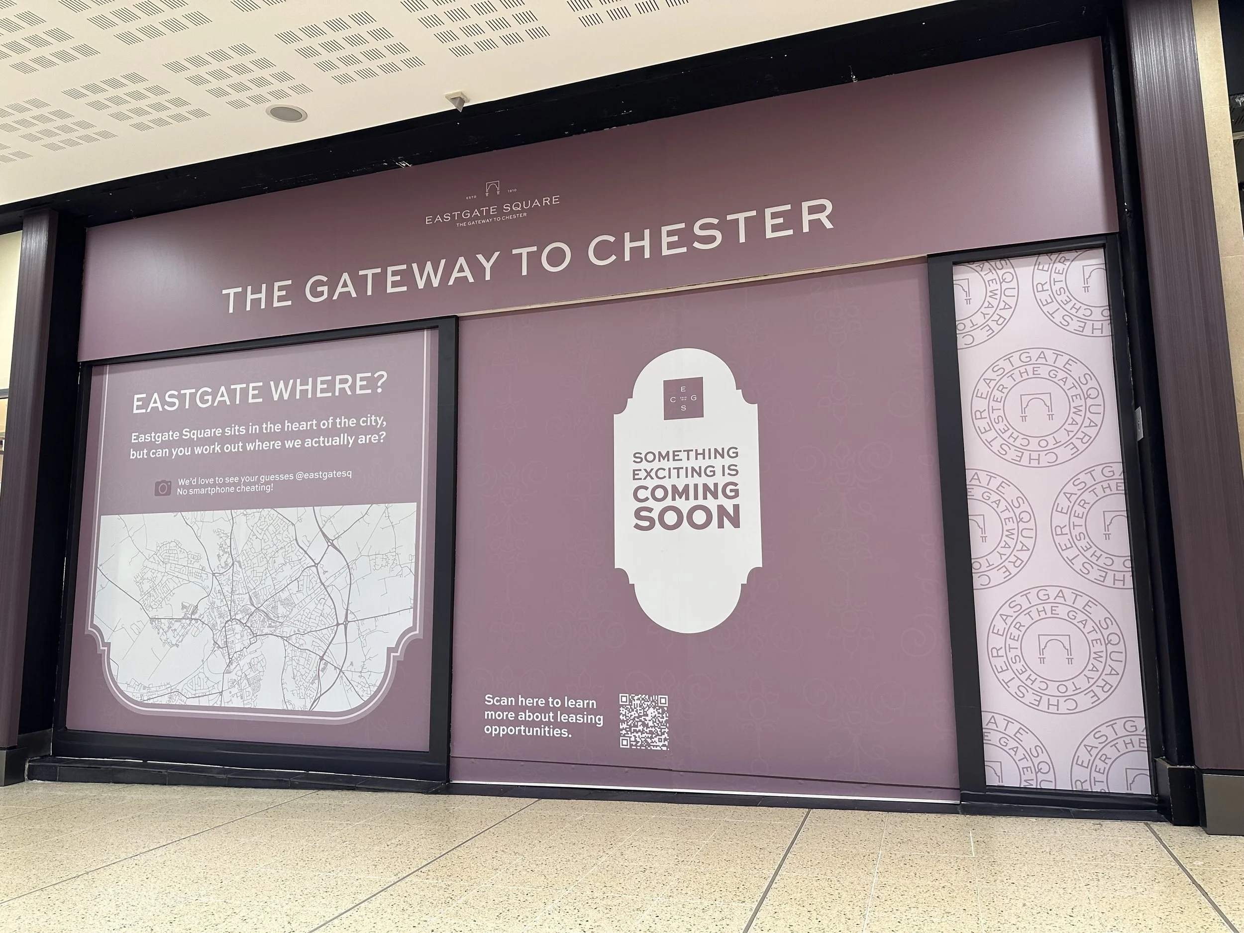 An image of a storefront with eye-catching window graphics.