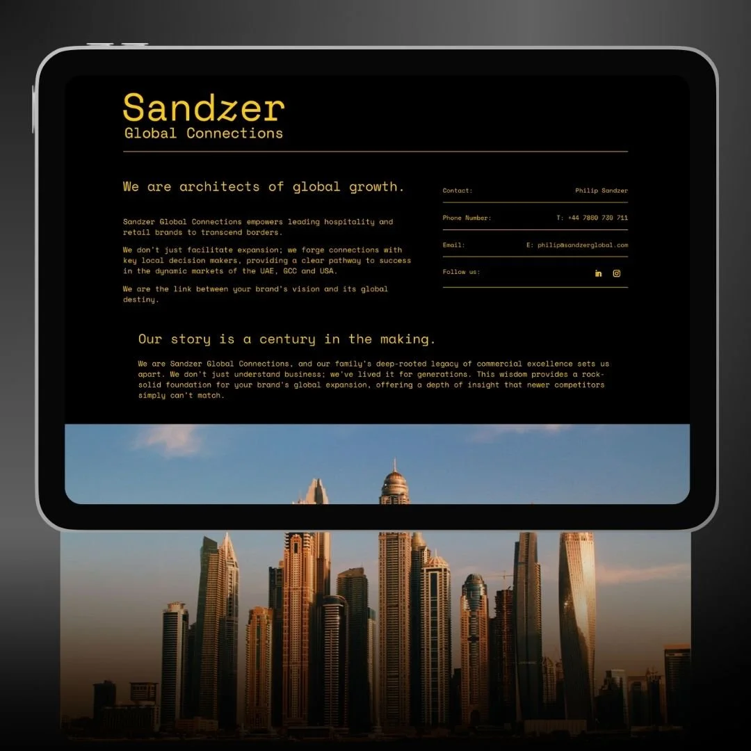 A digital display showing information about Sandzer Global Connections, a company that specializes in global growth and branding, with a city skyline in the background.