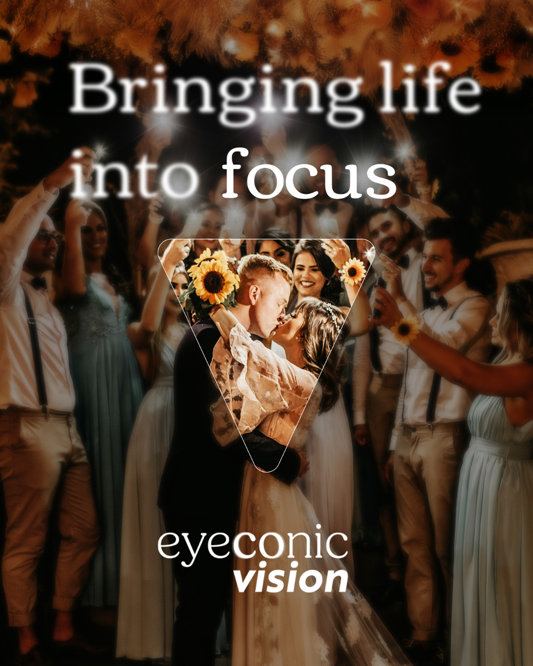 A wedding celebration with a bride and groom sharing a kiss, surrounded by friends and family holding sparklers and sunflowers at night.